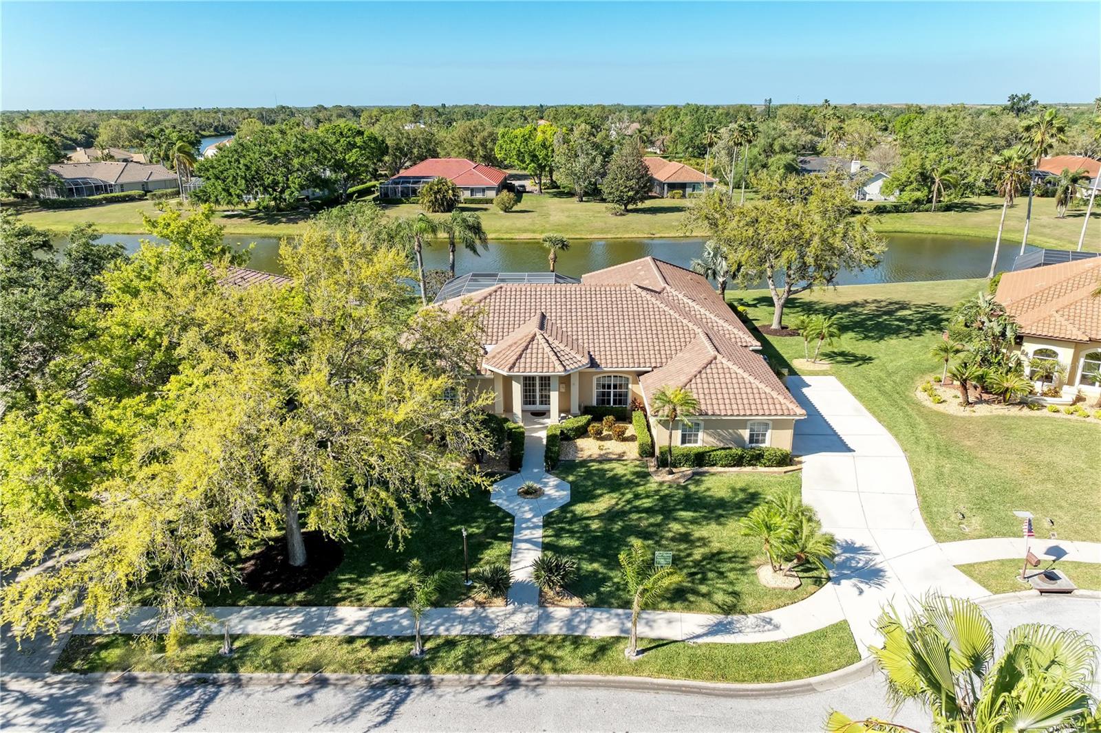 LAKE VIEWS! 4BR/3BA + Living room & dining room, huge family room. Kitchen with island. 3 car garage. Whole house water softener. Pool & deck area w/ 2 lanais.  FSBO Fully Furnished..