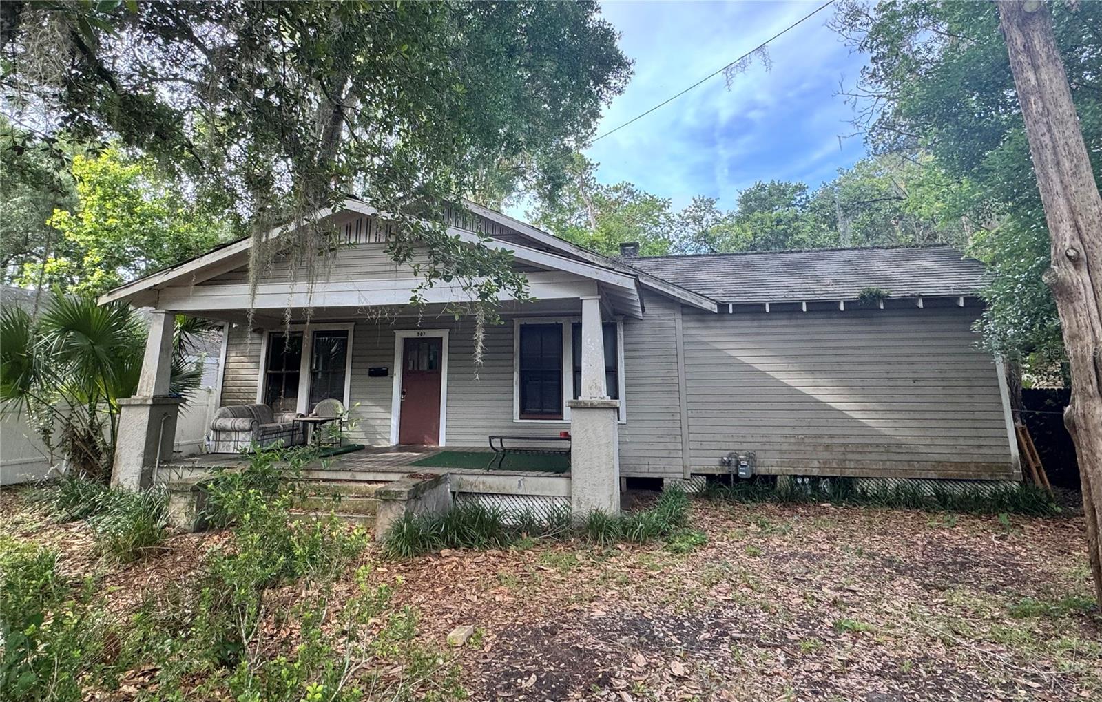 **INVESTOR'S ALERT**  Located only 1.3 miles to the University Of Florida.  Cute house with lots of potential for an AirBNB or rental. The MAIN HOUSE has 3 bedrooms and 1.5 bathrooms.  The attached ADU is an additional studio with kitchenette and full bath. It has its own separate entrance perfect for mother in law area, another spot for rental income or rent out and live in the main house. Solid wood flooring through most of the house, large living room with access to the hallway or into the dining area with built in cabinets. From the dining room it leads to the kitchen. Newer looking paint and light fixtures. Keeping the original charm but needs some updates.  2022 HVAC The owner also has several other investment properties available for sale. Please reach out to the list agent for more info.