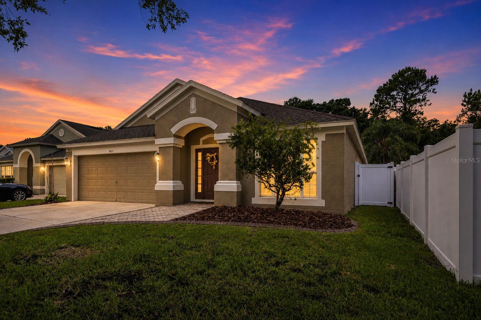 NO CARPET | BRAND-NEW GRANITE | OVERSIZED FENCED YARD | SCREENED LANAI | GOLF COMMUNITY | NO REAR NEIGHBORS. Perfectly located just minutes from I-75, this well-maintained 4-bedroom, 2-bathroom home in the desirable Lexington Oaks golf community offers the ideal combination of comfort, privacy, and convenience. Enjoy quick access to The Grove at Krate, shopping, restaurants, entertainment, highly rated schools, and all of the exciting growth in the Wesley Chapel area. Inside, you'll find a thoughtfully designed split floor plan with all bedrooms situated on the left side of the home for added privacy, while the living, dining, kitchen, and family room flow together on the opposite side, creating an ideal layout for everyday living and entertaining. The spacious kitchen has been refreshed with brand-new granite countertops, matching new granite in both bathrooms, updated lighting, and new ceiling fans in select areas. Best of all, there's no carpet anywhere in the home, making maintenance easy and giving the home a clean, modern feel. The kitchen sits at the heart of the home and features a casual breakfast nook while overlooking the rear family room, creating a bright and inviting gathering space. Ample closet space throughout provides plenty of storage for the whole family. Step outside to enjoy the oversized, fully fenced backyard with a large screened lanai, offering the perfect setting for relaxing, entertaining, or enjoying Florida's beautiful weather. With no rear neighbors and a natural backdrop of mature trees and landscaping, you'll appreciate the added privacy this homesite provides. Located in the sought-after Lexington Oaks community, residents enjoy a championship golf course, beautiful surroundings, and an unbeatable location close to major commuter routes, shopping, dining, parks, medical facilities, and everything Wesley Chapel has to offer. This move-in-ready home is one you won't want to miss.