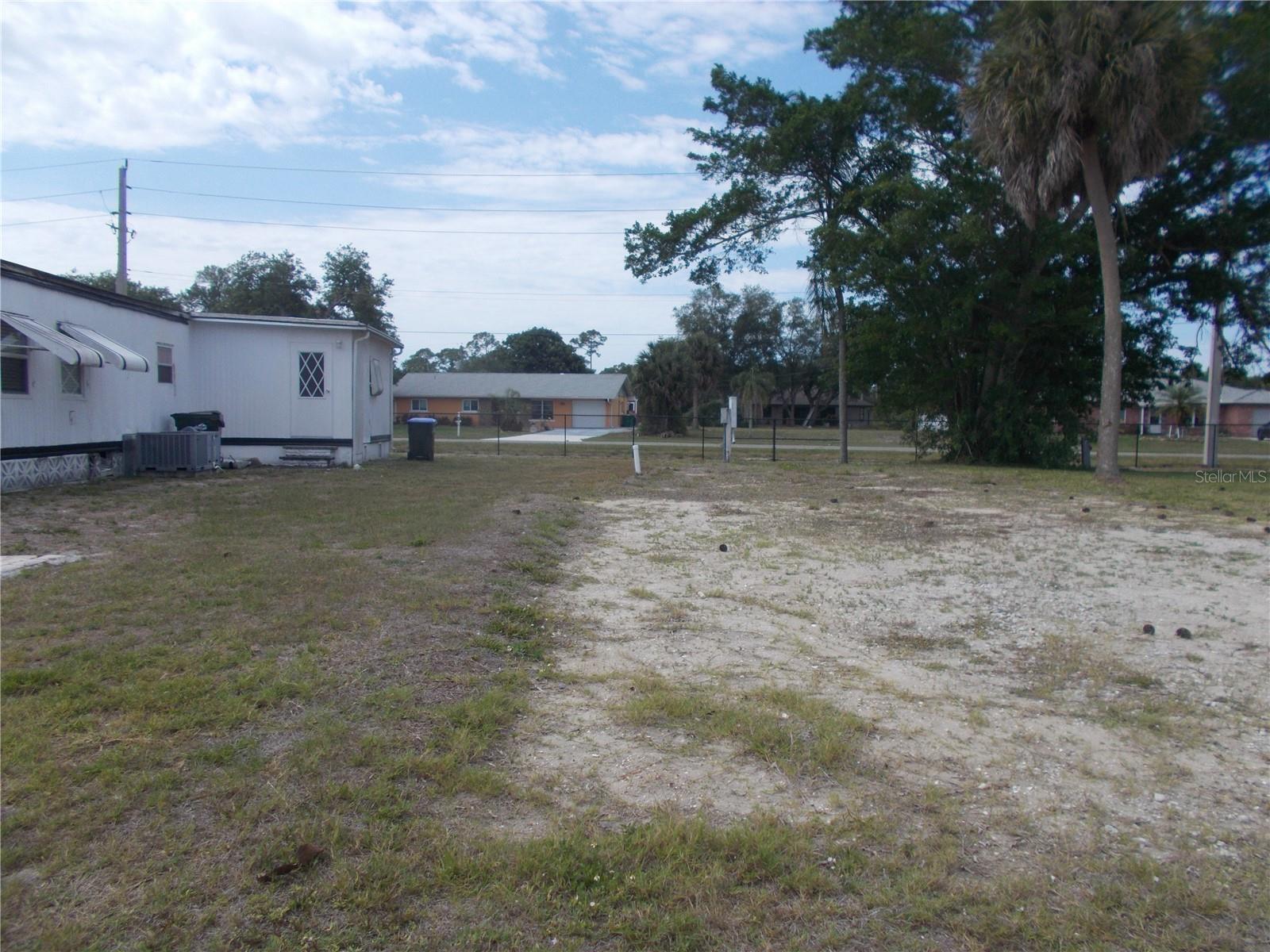 VACANT LAND in the sought-after 55+ Mobile home Gated Community of Holiday Park and in the Pet Section. The land is located on Palena Blvd and is backed by Chancellor Blvd. In Holiday Park you own the land with a deed and the maintenance fee $2340.00 a year ($195.00) is included in your taxes. Holiday Park offers many amenities including 2 Pools, Tennis Courts, Pickle Ball, Bocci, Shuffleboard, Laundry, Library, Horseshoes, Bingo plus other card games, Fitness Room and so much more. This home has been pulled off and electric and water are in place. This is a perfect place for your new manufactured home. Come and see!