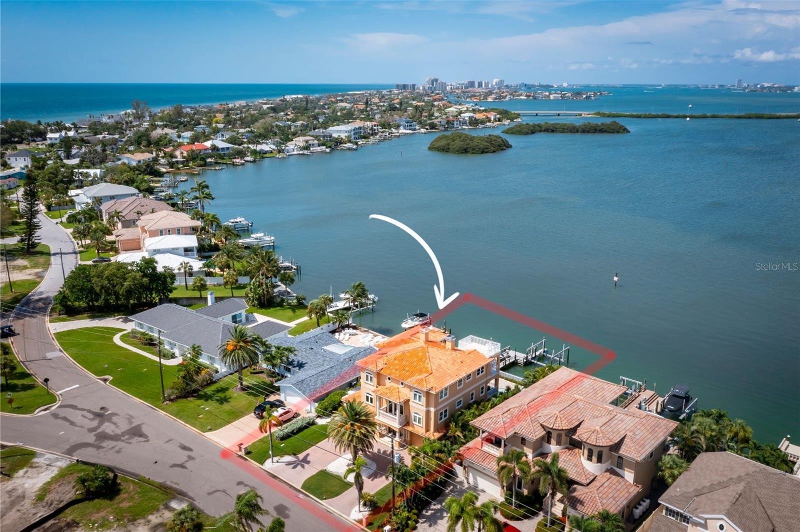 Direct Gulf access, deep water Intracoastal frontage, a 25,000 lb boat lift, and an assumable flood policy of just $1,800 per year—an exceptional combination rarely found in today's waterfront market. Positioned on the Intracoastal Waterway in the heart of Indian Rocks Beach, this custom-built waterfront estate offers over 4,500 square feet, 5 bedrooms, 4 baths, a private dock, saltwater pool, heated spa, elevator, and panoramic water views from nearly every main living space. Designed and built by its original builder-owner, the home was thoughtfully crafted for boating, entertaining, and everyday waterfront living. The oversized primary suite serves as a private retreat with a fireplace, private waterfront balcony, and spa-inspired bath. A chef's kitchen featuring custom wood cabinetry, granite countertops, a large island, walk-in pantry, and butler's pantry opens to spacious living and dining areas designed to capture stunning water views throughout the day. The lower-level social room creates the perfect transition to outdoor living, where the saltwater pool, heated spa, dock, and expansive waterfront setting invite endless days on the water and unforgettable sunset evenings. An added bonus is the home's eastern rear exposure, allowing the pool and outdoor living areas to enjoy morning sun while the house provides shade during the hottest part of the afternoon, helping keep the pool and entertaining spaces more comfortable throughout the summer months. A private elevator services all levels, while the rooftop terrace offers sweeping Intracoastal views. Additional features include a 5-car garage, optional climate-controlled gym, smart home technology, high ceilings, and no HOA. For boating enthusiasts, the location is exceptional. Reach the Gulf within minutes, enjoy deep water access, and keep your vessel protected on the 25,000 lb lift just steps from your back door. The home also performed exceptionally well during recent storms, offering added peace of mind. Short-term rentals are permitted, creating outstanding income potential in one of Tampa Bay's most desirable beach communities. Just a short walk to the sugar-sand beaches of the Gulf of Mexico, Brown Park, tennis courts, restaurants, and local favorites, this home offers the rare opportunity to enjoy true barrier island living. Wake up to dolphins in your backyard, spend the day boating, fishing, or at the beach, then enjoy waterfront sunsets from your pool, spa, or rooftop terrace. Despite feeling worlds away, you're only about 15 miles from Clearwater Beach, 20 miles from Downtown St. Petersburg, and approximately 25 miles from Tampa International Airport, providing convenient access to world-class dining, entertainment, professional sports, and international travel while enjoying one of Florida's most coveted coastal lifestyles.  Call today for your private tour or to be sent the FULL video walkthrough.