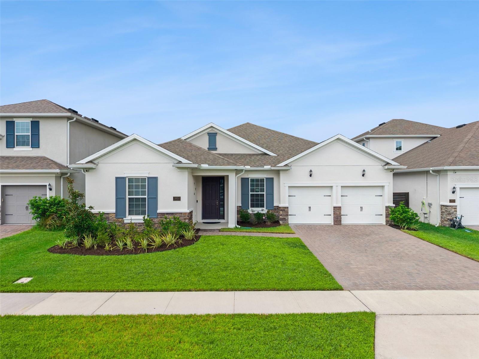 Welcome to this beautiful 4-bedroom, 3-bathroom home, an exceptional Arlington floor plan by Dream Finders Homes, located in the highly sought-after Summerdale Park community in the heart of Lake Nona. Built in 2023 and featuring over $100,000 in builder upgrades, this stunning residence perfectly blends luxury, style, and modern functionality. Step inside to an inviting open-concept floor plan enhanced by beautiful wood plank flooring, soaring ceilings, upgraded designer light fixtures, and abundant natural light. Just off the main living area, a versatile bonus room with elegant glass French doors offers the perfect space for a home office, art studio, gaming room, fitness area, playroom, or additional flex space to suit your lifestyle. The gourmet chef's kitchen is the heart of the home, showcasing a large quartz island, upgraded 42-inch cabinetry, quartz countertops, a beautiful designer tile backsplash, built-in stainless steel appliances, a pot filler, and a spacious walk-in pantry, perfect for entertaining and everyday living. The expansive family room flows seamlessly from the kitchen, creating the ideal setting for gathering with family and friends. Retreat to the spacious Primary Owner's Suite, featuring a custom walk-in closet organization system and a luxurious spa-inspired ensuite complete with dual quartz vanities, a freestanding soaking tub, and a large walk-in shower with an elegant rain shower head. Three generously sized secondary bedrooms provide flexibility for family and guests. Additional highlights include a convenient interior laundry room located just off the garage entry drop zone, a whole-house water softener, Smart Thermostat with an additional temperature sensor for enhanced comfort, a whole-house security system, and exterior security cameras with DVR for added peace of mind. Enjoy Florida's year-round lifestyle from the covered and screened-in lanai featuring beautiful wood decking, overlooking the fully fenced backyard, an ideal setting for morning coffee, weekend barbecues, and entertaining family and friends. The finished garage features a durable epoxy-coated floor, providing a clean, polished look that's perfect for parking, storage, or a workshop. Summerdale Park offers outstanding resort-style amenities, including a destination-style swimming pool, community dock, covered picnic pavilion, and playground. The HOA also includes 1 Gig Fiber Optic Internet, adding exceptional value and convenience. Ideally located in the heart of Lake Nona, you're just minutes from Medical City, the VA Medical Center, Nemours Hospital, UCF College of Medicine, Orlando International Airport, SR 417, premier shopping, dining, entertainment, and top-rated schools. This nearly new, move-in-ready home offers luxury finishes, exceptional builder upgrades, smart home technology, premium outdoor living, and an unbeatable Lake Nona location. Don't miss your opportunity to own one of Summerdale Park's finest homes. Schedule your private showing today!