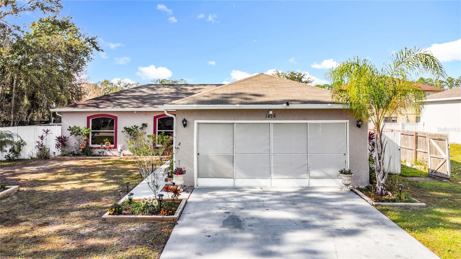 This well-maintained pool home offers numerous updates and desirable outdoor features. The roof was completed in 2017, providing added peace of mind. The kitchen has been updated, along with partial updates to both the master and guest bathrooms. The interior has been freshly painted and includes new light fixtures and ceiling fans in all bedrooms and the living room, creating a bright and comfortable atmosphere. Additional features include gutters, a screened garage, and a screened back porch for year-round enjoyment.The fully fenced backyard is perfect for entertaining or relaxing and includes a small deck with awnings, an above-ground pool, and a storage shed. Located in Poinciana Villages HOA, residents enjoy access to community pools, fitness centers, parks, playgrounds, walking trails, and recreational facilities, along with community events and activities. Conveniently situated on a quiet cul-de-sac, this home offers comfort, functionality, and an active community lifestyle. There are four additional spaces available for parking in the driveway.