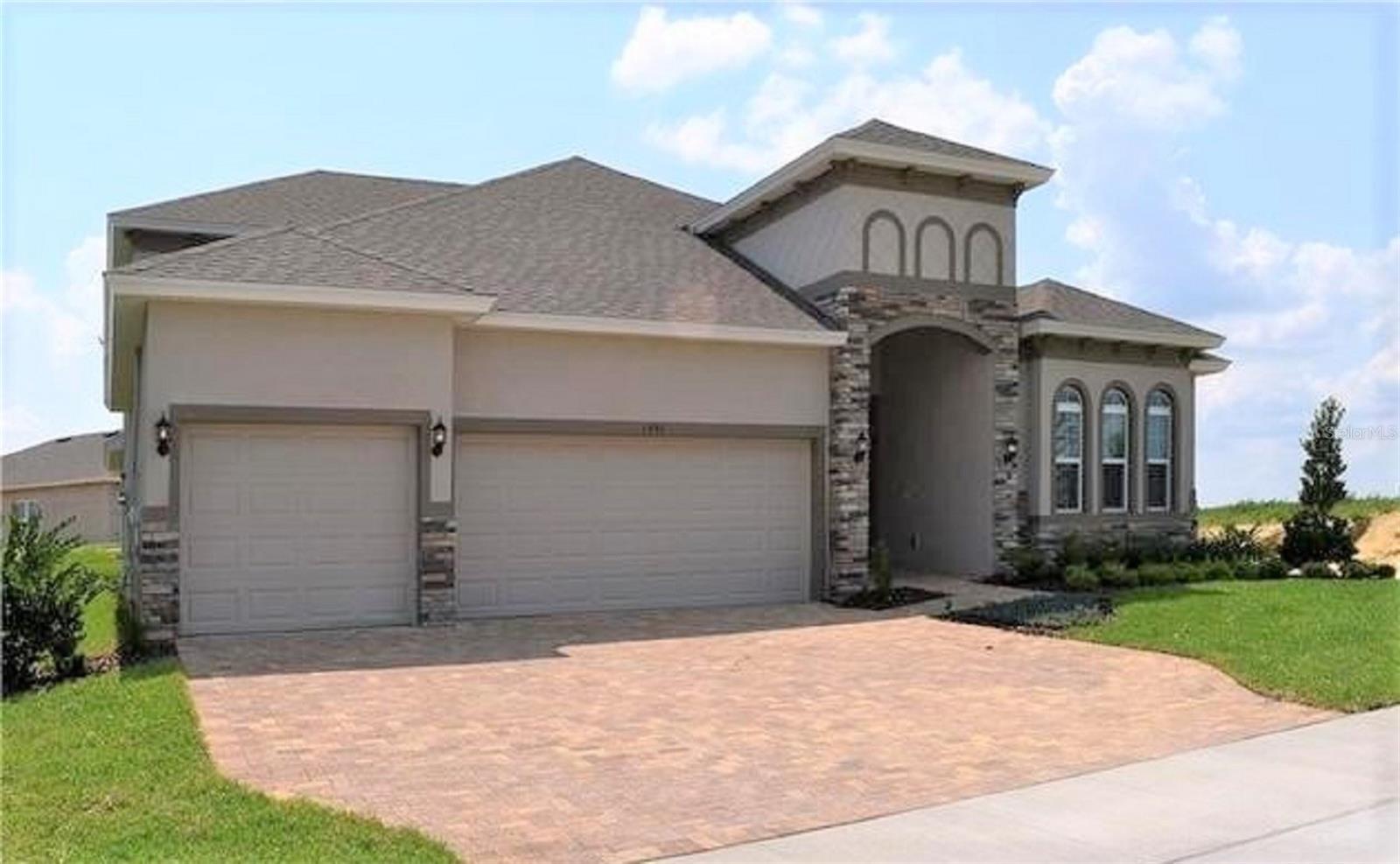 One or more photo(s) has been virtually staged. Discover the impressive Avalon with Bonus—a spacious and highly upgraded 4-bedroom home plus Bonus Room, offers exceptional living in Hills of Minneola. This beautifully designed floor plan features a generous bonus/media room, perfect for movie nights, a game room, or an additional family retreat. The highlight of the home is the huge chef’s kitchen, complete with expansive prep space, quartz countertops, premium cabinetry, and upgraded finishes throughout. Stylish laminate flooring flows seamlessly through the main living areas, adding warmth and durability. Situated on a desirable corner lot, this home provides added privacy, natural light, and room to enjoy outdoor living. Thoughtful upgrades are featured in every room, delivering both luxury and functionality. Located within the master-planned Hills of Minneola community with resort-style amenities, convenient Turnpike access, nearby shopping and dining, and the new Minneola Horizon Academy K–8 just minutes away. A true standout home!