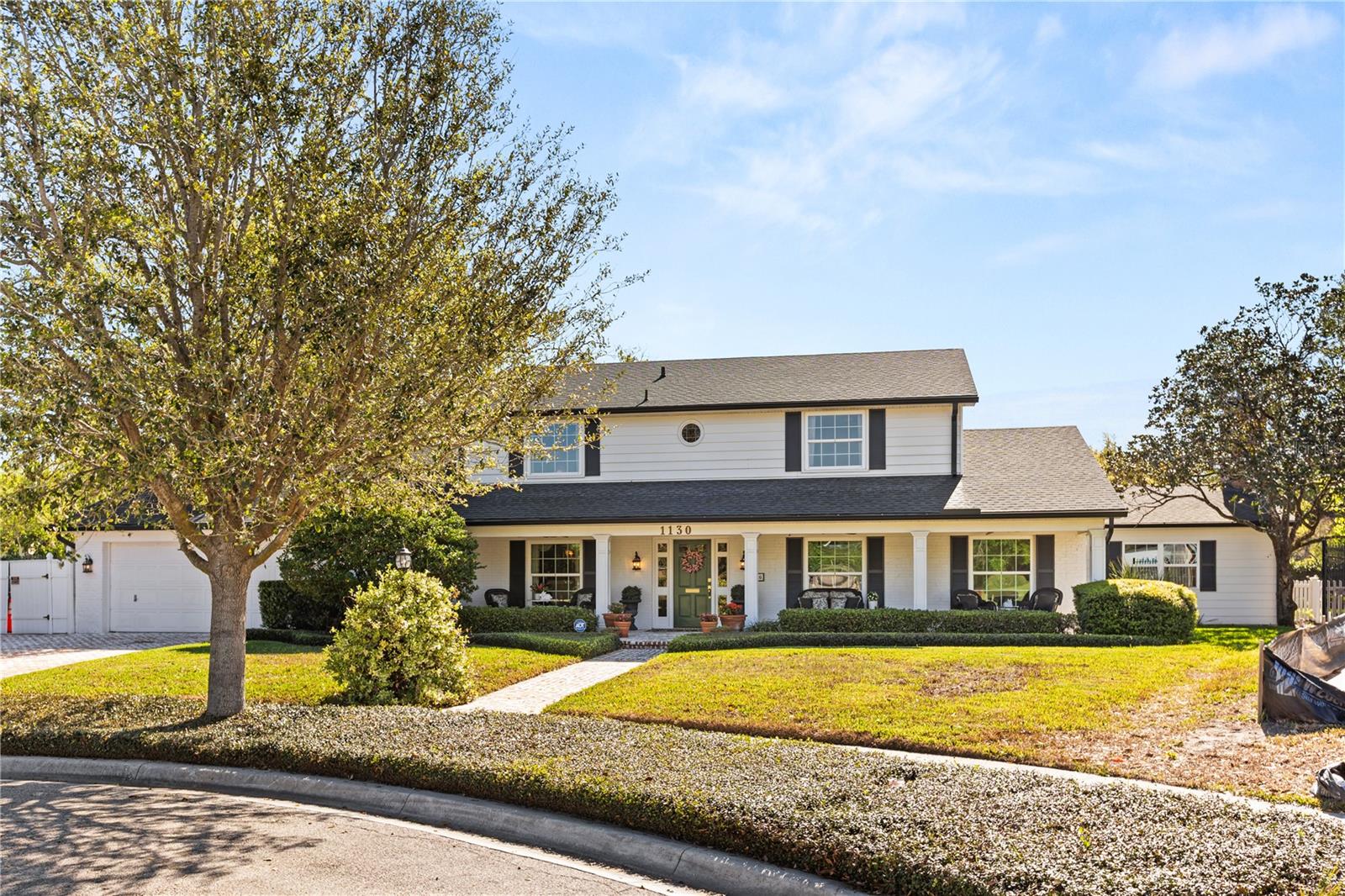 Half-acre lot just steps from Park Avenue shopping and dining, tucked on a quiet cul-de-sac in the heart of Winter Park.
This traditional two-story home offers a well-designed floorplan for both everyday living and entertaining. From the moment you enter, the home feels warm and inviting. The main level features a spacious primary suite along with connected living spaces that flow easily from room to room. The primary suite and family room both offer tall ceilings and abundant natural light, creating a bright and comfortable living area.
The kitchen opens to the casual dining area and family room, forming a central gathering space. French doors lead to a screened patio with a southern feel, overlooking a generous backyard on nearly half an acre.

At the front of the home, a separate living room provides a quieter setting, while the formal dining room is complemented by a butler’s pantry for easy entertaining. Upstairs, four additional bedrooms feature original hardwood floors and spacious layouts, offering flexibility for guests, family, or a home office.

An ideal location with close proximity to Park Avenue and the Winter Park 9, offering easy access to shopping, dining, and golf.