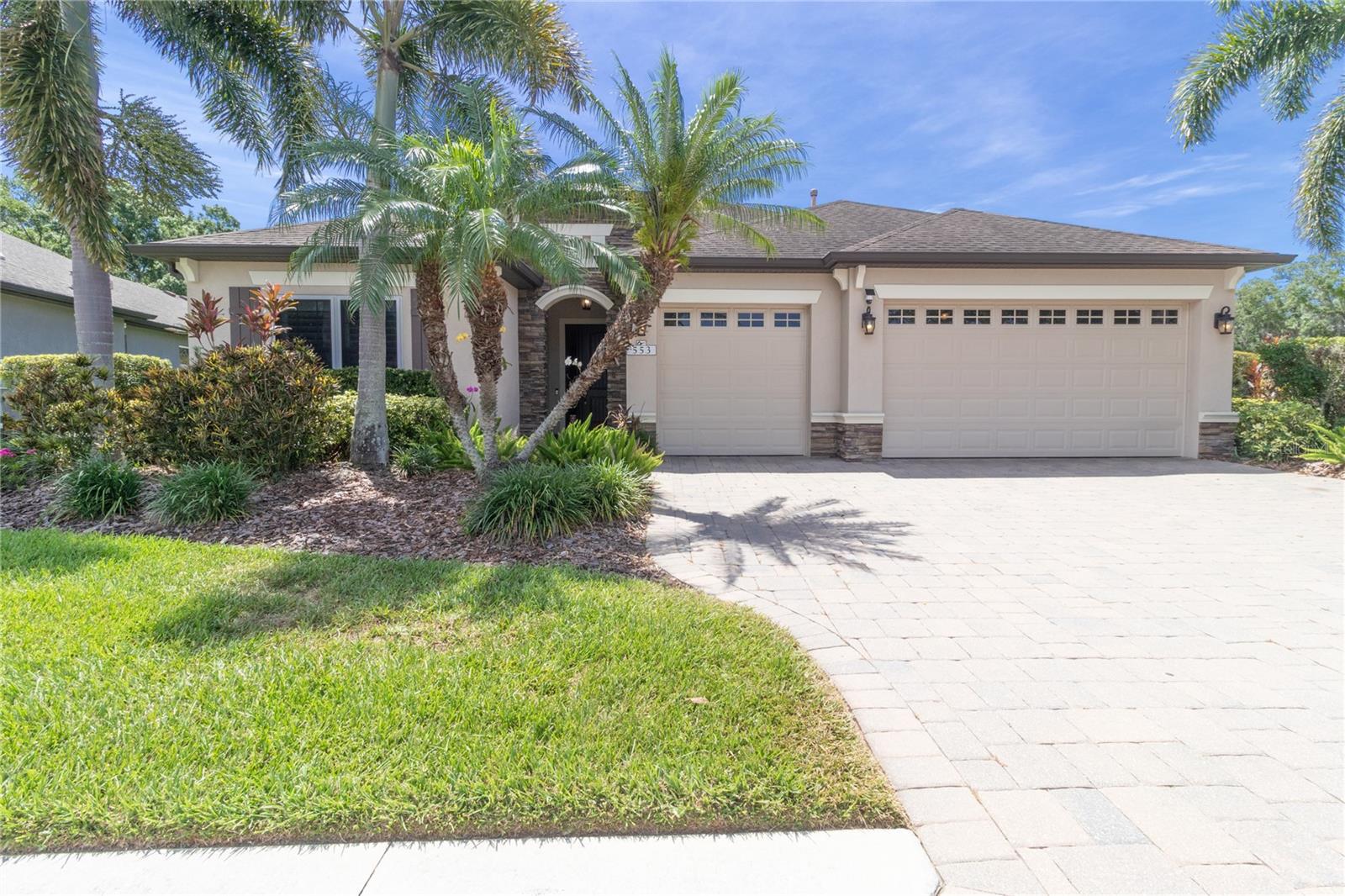 Welcome to Greyhawk Landing, one of East Manatee County's most sought-after gated communities, where resort-style amenities, natural beauty, and an active lifestyle come together. Situated on a private preserve lot, this impressive 4-bedroom, 3-bath 2015 built Kingsley model is one of the community's most desirable floor plans, offering generous living spaces, thoughtful design, luxury finishes, and exceptional energy efficiency. 


Step inside and be captivated by the soaring vaulted ceilings and expansive open-concept design. The spacious great room flows seamlessly into the heart of the home—a stunning gourmet kitchen featuring a gas cooktop, built-in oven, microwave/convection oven, breakfast bar, dinette area, and a dramatic custom exhaust hood that extends all the way to the peak of the vaulted ceiling, creating a truly unforgettable focal point. For more formal occasions, enjoy a separate dining room perfect for entertaining family and friends.

The thoughtfully designed Kingsley floor plan offers flexibility and privacy. The luxurious primary suite features coffered ceilings, two WALK-IN CLOSETS, sliding glass doors to the screened lanai, and a spa-inspired ensuite bath with split vanities, a large walk-in shower, and private water closet. Bedrooms two and three are generously sized and share a full bath, while the fourth bedroom and third bath are tucked behind a pocket door and feature a separate exterior entrance—ideal for guests, MULTI-GENERATIONAL LIVING, a home office, or private retreat.

Additional features include tile flooring throughout, an indoor laundry room with utility sink, a mudroom with built-in desk, and an oversized three-car garage providing abundant storage space.

Enjoy peace of mind with numerous protective features including in-wall pest control, HURRICANE SHUTTERS for the sliding glass doors, and the revolutionary Crimsafe HURRICANE IMPACT SCREENS on all windows.

This home is also equipped with SOLAR PANELS and a TESLA HOME BATTERY BACKUP SYSTEM, dramatically reducing energy costs while providing power security during storms and outages. Best of all, the SOLAR SYSTEM WILL BE PAID IN FULL AT CLOSING—providing immediate savings for the new owner with no additional expense.

The fenced backyard overlooks a peaceful preserve, creating a private setting perfect for pets, outdoor enjoyment, and watching Florida's natural wildlife.

One of the greatest advantages of this home is that you can enjoy all the benefits of Greyhawk Landing's exceptional amenities without the responsibility of maintaining a private pool. The community pool is conveniently located just around the corner, allowing residents to enjoy swimming and recreation without the added expense, maintenance, insurance concerns, or safety worries often associated with private pools.

Should you decide on a pool for yourself, there is plenty of room and the home has already been readied for either a pool, an outdoor kitchen, or both!

Greyhawk Landing offers an unmatched lifestyle with multiple community pools, pickleball courts, tennis courts, basketball courts, playgrounds, scenic lakes, fitness opportunities, and miles of picturesque nature trails winding through beautifully preserved landscapes.

This exceptional home combines luxury, practicality, energy efficiency, and resort-style living in one of the area's most desirable communities. Don't miss this rare opportunity to enjoy the very best of Greyhawk Landing.