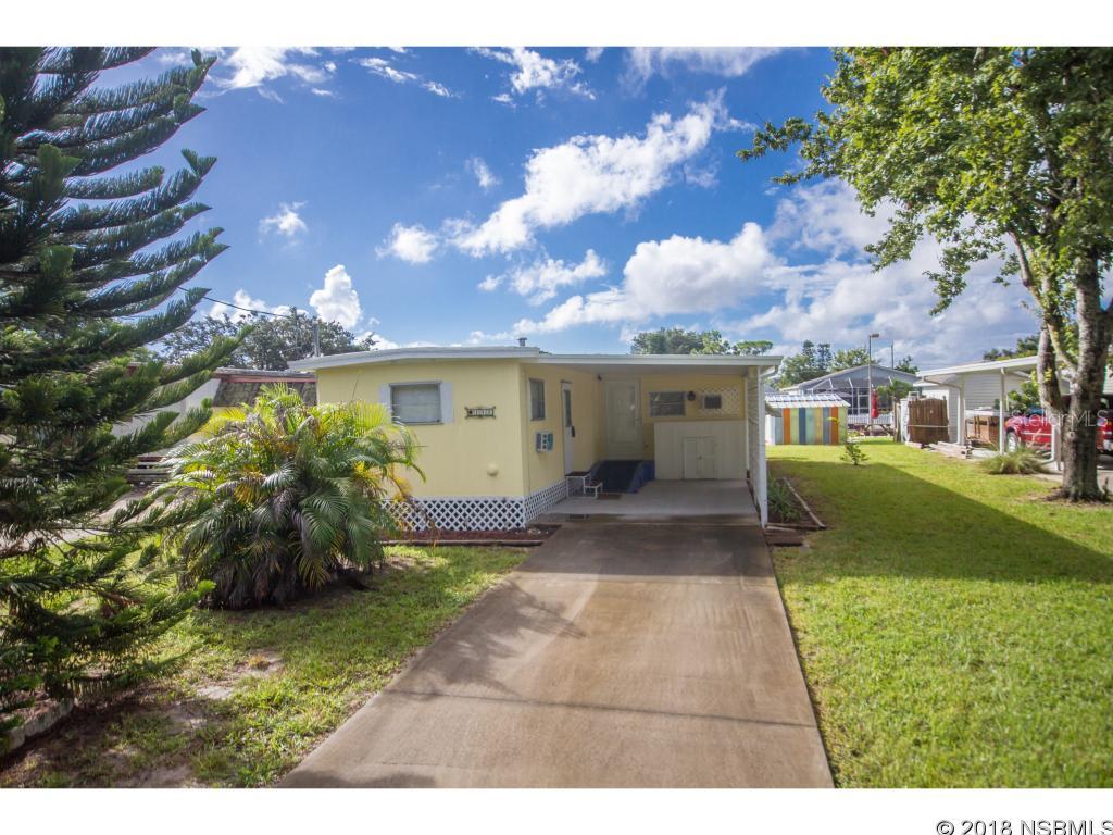 Look no further for your Canal Front Getaway. Super Cute lil Mobile home on deep water canal with your own private boat ramp and dock. Park your boat here and enjoy easy access to the intracoastal waterway.  New in 2014, Refrigerator, Gas Range, Dishwasher, Stackable Washer/Dryer, Water Heater, 2 Window Unit Air Conditioners, @ Exterior Doors, Bathroom Vanity and Toilet, 120V Winch at Top Of Boat Ramp. Seawall and Boat Dock also replaced in 2014 as well as Canopy over the boat ramp to protect your boat from the sun.This mobile home is quaint and move in ready.  Come on by and take a look for yourself... All Measurements are approximate. Buyer should verify for accuracy. ;Water: City