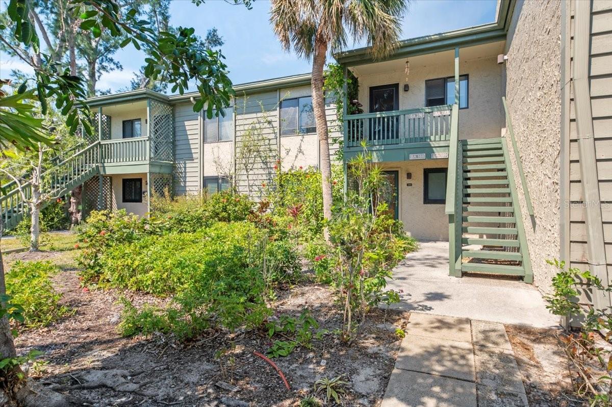 Welcome to your fully furnished, TURNKEY water view condo. Simply move-in and take in the tranquil Little Sarasota Bay and marvel at the dolphins, manatees, birds, and other wildlife. This remodeled 2 bed/2 bath condo features soaring cathedral ceilings, clerestory windows, generous open floor plan and luxury vinyl flooring throughout. This bright and peaceful second-floor unit is centrally located within the 75-acre, botanic garden-like setting of Pelican Cove. Across the way is the private picturesque 87-boat slip harbor. Boat and kayak to Midnight Pass and have direct access to the gulf. Residents gain entry to the unique blend of natural habitats, miles of scenic trails, a fitness room, multiple heated pools and hot tub. There are six new pickleball courts and resurfaced tennis courts with active clubs for play. Many more recreational and cultural events are hosted year around. Robust live music, art and culture, and educational seminars are abundant in season. The community is also conveniently located with shopping and restaurants nearby. Siesta Key and downtown Sarasota are in very close proximity as well.