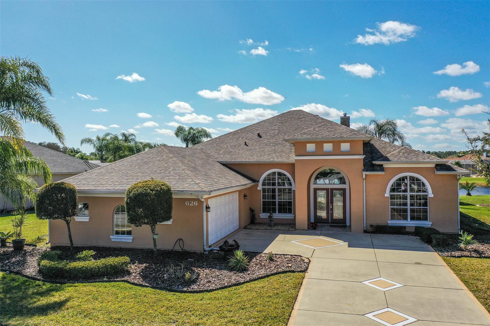 Your Personal Paradise - This custom Paytas-built 3 BR / 2 1/2 Bth home is Beautiful! Enter through the Grand Foyer and instantly take in the exquisite feeling and design of the open floor plan with high ceilings, alcoves, special lighting, expansive windows for natural light, tile and wood flooring, and custom plantation shutters throughout. Capture stunning panoramic views of the fountains on the lake from the Great Room while relaxing in front of the gas fireplace. The Formal Dining Room and Over-sized Office/Den showcase Brazilian Cherry hardwood floors. Delightful Chef's Kitchen features Silestone countertops, wood cabinetry, center island, stainless appliances, enormous pantry, a snack bar and lovely nook area. Enjoy the Main BR Retreat with sitting area, tray ceiling, sliders to the pool/Lanai - Luxury Ensuite has a large walk-in closet, double sink vanity, a jetted tub and a glass enclosed walk-in tiled shower. Two spacious Guest Bedrooms are privately located and share a large Guest Bathroom. Indoor Laundry Room and over-sized 2 Car Garage with extra storage space. A Half Bath has direct access to the pool area. Step onto the Covered Lanai and you will understand how this is the perfect home for relaxing, entertaining and enjoying the Florida lifestyle! This 56' x 42' screened area features a Lanai Dining/Seating Area; a Sparkling Pool with two fountains, a waterfall and pool fencing; a Cabana with Full Summer Kitchen; and a Raised Sunning Deck - All overlooking the endless lake views. The owner has maintained this home to be Move-in Ready. Within the past 4 years, you get NEW 50-year architectural shingle roof, pool screen, pool pump, dual AC units, HWH, and kitchen appliances. Venetian Bay offers a championship golf course, fitness and swim clubs (membership required), walking and biking paths, salon, marketplace & cafes within minutes to the beaches & easy access to the I-95 corridor. Schedule your private showing today! Buyer to verify all information. ;Water: City