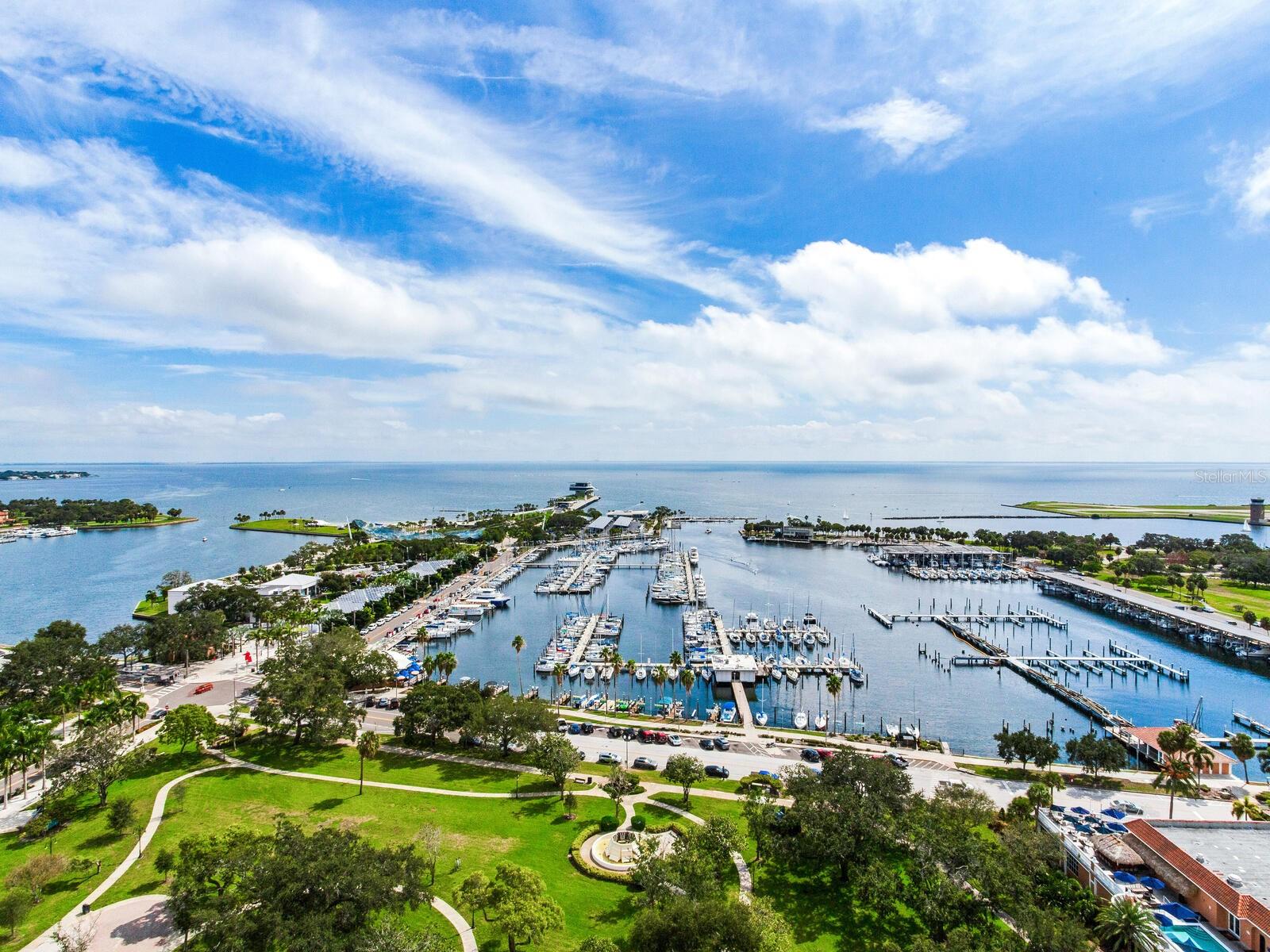 HIGH AND DRY NO STORM DAMAGE STUNNING LUXURY DOWNTOWN CONDO WITH UNMATCHED PANORAMIC VIEWS OF TAMPA BAY AND THE PIER. A rare opportunity to own one of the premier residences in St. Petersburg, this 20th floor condo in the exclusive Florencia boasts one of the best views in the city. This 3 bedroom, 3 ½ bathroom condo of 2,758 sq ft (AC) has undergone a sophisticated designer remodel with a modern flare, custom cabinets and immaculate luxury finishes throughout. As you enter this unique residence your eyes will be immediately drawn across the great room to the wall of huge picture windows framing breath-taking views of Tampa Bay, the pier and the city. The wall of windows bathes the entire great room with natural light creating an inviting and airy feeling to this expansive room. Large enough for multiple seating areas, a formal dining area, breakfast area and large chef’s kitchen, the great room provides true open-concept living. Two beautiful waterfront terraces flank each end of the great room providing additional living and entertaining space. The custom kitchen will inspire any chef with Miele steam-oven, Miele induction cooktop, Sub-Zero refrigerator, an abundance of custom cabinets and walk-in pantry. The large two-toned, two-tiered island with dining area and wine refrigerator is center stage for entertaining and dining events. Each morning will be a joy with an expresso from the built-in Miele espresso maker sipped on one of the terraces watching a magnificent sunrise over the calm Tampa Bay waters. Off the great room is an interior space perfect for a media room or spacious home office. The premiere bedroom suite is truly a romantic retreat. The expansive bedroom opens to one of the waterfront terraces providing amazing open water views. Two walk-in closets provide plenty of custom storage. The en suite bathroom will impress like a high-end spa with long counters, custom cabinets, dual sinks, dual shower-head shower and electric TOTO toilet. Family and guests will truly enjoy their stay with two guest bedroom suites at opposite ends of the condo, each enjoying full bathrooms and open water and city views. Off the impressive foyer is a magnificently designed powder room fit for the pages of an interior design magazine. A separate laundry room, two storage/utility rooms (one inside the unit and one just outside), hurricane shutters for the terrace sliders, electric window shades, and reverse-osmosis water filtration system round off the interior features of this amazing residence. This luxury property also comes with two secured garage parking spaces with EV charger and climate controlled storage locker. The Florencia is a 48 residential unit building with a luxury boutique hotel feeling. Catering to those desiring elegance and privacy, this stunning property has amenities rivalling those of much larger buildings including a heated pool and spa, fully equipped fitness center, social room with billiards, on-site manager and concierge service. Perfectly situated in the heart of downtown, this amazing residence is just steps from world-class parks, museums, restaurants, entertainment and shopping. Make an appointment to tour this incredible residence today!