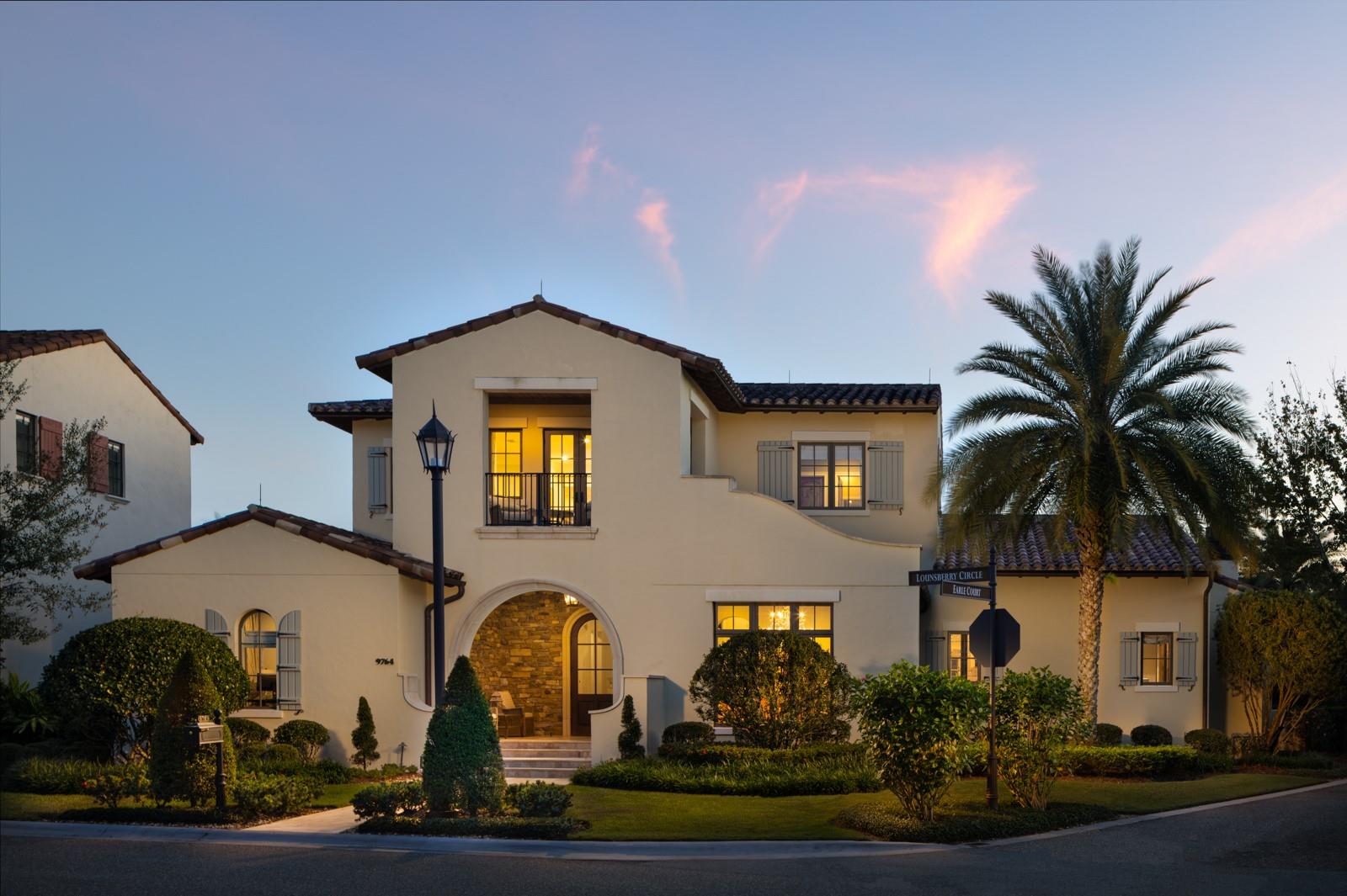 Welcome to 9764 Lounsberry Circle, located in the Kimball Trace neighborhood at the exclusive Golden Oak community at the Walt Disney World Resort. This stunning property was built by ISSA homes, and the floor plan is known as the Pacifico. The home offers five bedrooms, with five en-suite bathrooms, and two powder rooms. Spanning over 4,300 square feet, every detail was captured in the construction and design on this home. It offers uncompromising quality. Upon entry, you are greeted by a two-story grand foyer that welcomes you into the open concept great room. This spacious living area is flooded with natural light as the room is surrounded by large windows, with the focal point being the oversized pocket sliding glass door. This door opens to the thoughtfully designed courtyard pool, seamlessly blending your entertaining spaces. This space offers unmatched attention to detail in elevated features like the dining chandelier, wood beams, and painted plaster coved ceiling. The chef’s kitchen offers every amenity, including Wolfe + Sub-zero appliances with cabinet-level finishes, 6-burner gas range, wine fridge, plenty of storage, and expansive counter space. The first-floor primary suite offers a spa-like experience, with soaking tub, chandelier, dual sinks, oversized shower with mulitple shower heads, easy access to two walk-in closest, and direct access to the courtyard pool. Downstairs there is also a distinctive office, that can be utilized as a bedroom. The second level offers two additional guest bedrooms, a loft and a balcony overlooking quiet views of the Four Seasons Resort Orlando in the distance. Stepping into the courtyard, there is a unique feature of this home. The home’s fifth bedroom is a guest casita, with wet bar, located over the garage. A fantastic space to have, with many options for functionality. The courtyard also offers a covered lanai with motorized screens, an outdoor fireplace and outdoor kitchen. There is a two-car garage and a separate golf cart garage. The coveted community of Golden Oak offers an exquisite living experience, unlike any other in the world. This gated community features magnificent homes and world-class amenities. Some of the amenities include: access to Golden Oak's private clubhouse, Summerhouse, with a resort-style pool area, restaurant, bar, Golden Oak concierge service, and so much more. Don’t miss the opportunity to call this incredible residence your own, call today to schedule a private tour.