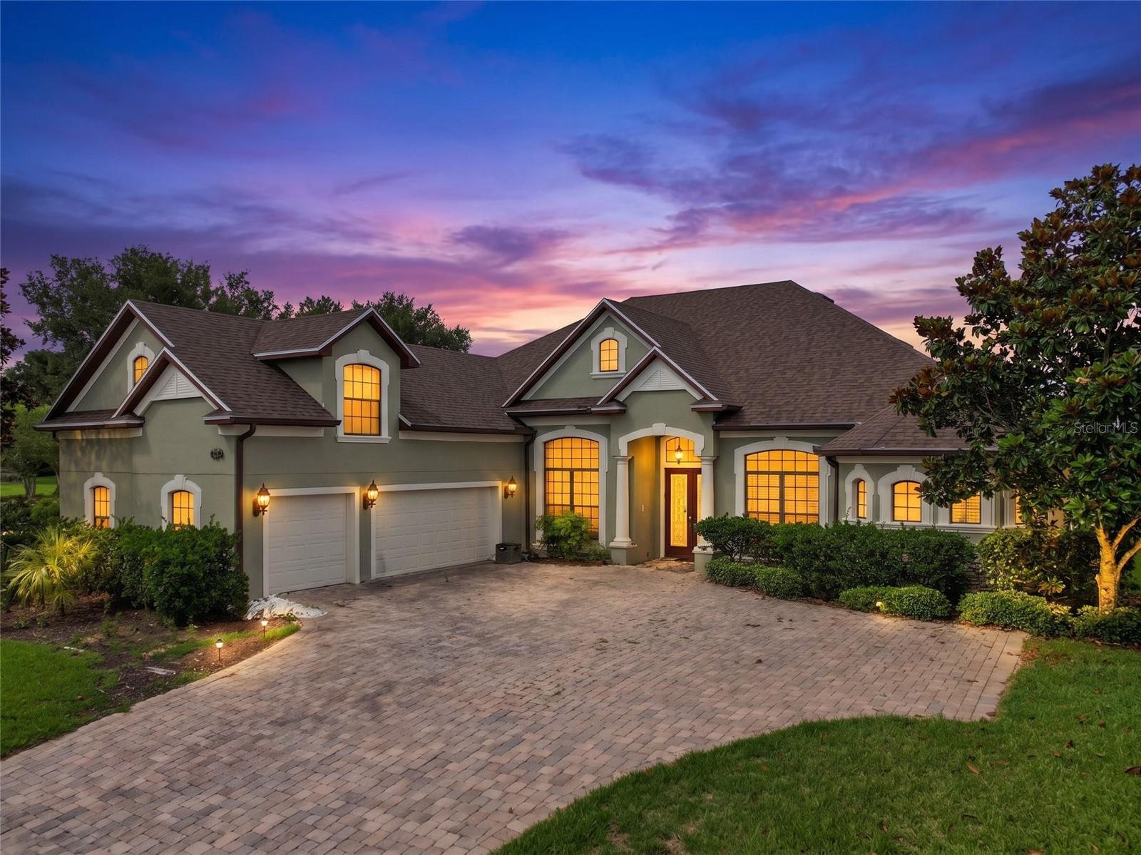 Luxury custom pool home with a 3-car garage in one of Clermont's most sought-after settings. A rare opportunity to own a residence loaded with high-end finishes, offered as a cash-only, as-is sale for the buyer or investor ready to make it their own.
Inside, an award-winning master suite anchors the home, complete with a fireplace framed by an arch and column, plus a jetted Jacuzzi in the bath. The kitchen showcases premium Wellborn cabinetry, granite counters, stainless steel appliances, and a custom range hood with matching wood trim. Entertain in the dedicated theater room, the game room with a wet bar and sunset balcony, or the executive den finished with wood floors and crown molding.
Additional highlights include a whole-home intercom and music system, security system, wrought iron stair railing, professional window coverings, upgraded front doors, wood shuttered doors upstairs, and a rear bonus room with its own terrace. Outside, enjoy a screened pool and spa with paver decking and solar heating, along with a summer kitchen built for poolside gatherings.
Ideally located minutes from new schools, the National Training Center, golf, shopping, and dining, with quick access to Highway 50, US 27, and the Florida Turnpike for easy drives to Orlando, Tampa, and Disney.
Sold cash-only and as-is, an ideal investment opportunity for the right buyer. Schedule your private tour today.