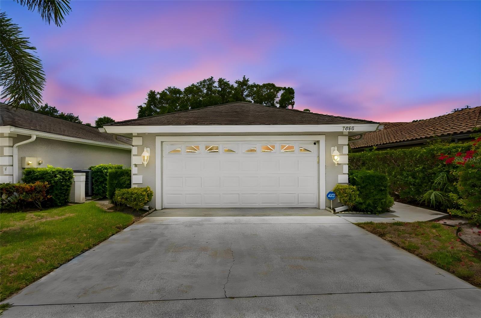 Welcome to maintenance-free living in the highly sought-after Palm Aire community of Sarasota. This beautifully landscaped end-unit residence is tucked away on a private street and offers the perfect blend of comfort, functionality, and Florida lifestyle.
Featuring 2 spacious bedrooms, 2 bathrooms, and a versatile flex space ideal for a home office, den, guest room, or potential third bedroom conversion, this home provides flexibility to fit your needs. The interior has been freshly painted and showcases plantation shutters throughout, adding timeless elegance and charm.
The functional kitchen includes an inviting eat-in dining area overlooking a private courtyard, creating the perfect setting for morning coffee or outdoor grilling. Entertain with ease thanks to the convenient dry bar and spacious living areas designed for everyday comfort.
One of the home's standout features is the fully enclosed, air-conditioned glass lanai offering approximately 140 square feet of additional living space with serene views of lush tropical Florida foliage, creating a peaceful retreat to enjoy year-round.
Located just a short walk from the clubhouse, residents enjoy access to an exceptional array of amenities including two championship golf courses, tennis courts, pickleball, a resort-style pool, fitness center, restaurant and bar, social 
clubs, events, and activities.
Conveniently situated just 10 minutes from University Town Center's premier shopping and dining destinations and Sarasota-Bradenton International Airport, with world-class attractions such as Mote Marine Laboratory & Aquarium only 30 minutes away. Experience the best of Sarasota living in one of the area's most desirable communities.