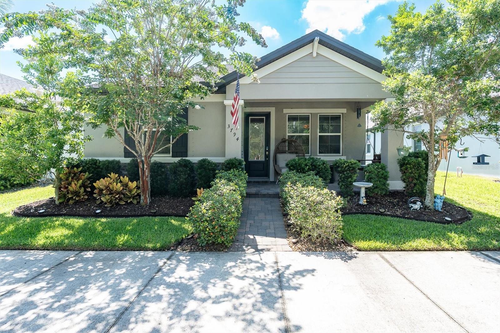 DISCOVER YOUR ENERGY EFFICENT DREAM HOME IN A QUIET LOCATION IN THE HEART OF TAMPA BAY'S PREMIER MASTER-PLANNED COMMUNITY: STARKEY RANCH! Ease of living awaits in this beautifully maintained home, ideally situated across from a private wooded view in the heart of Starkey Ranch, Tampa Bay's premier master-planned community. Built in 2019 by M/I Homes, this Avalon floor plan seamlessly blends comfort, style, and modern convenience. Fully paid SOLAR PANELS included adding to the homes extreme energy efficiency! With 1,765 square feet of thoughtfully designed living space, this 3 br, 2 ba home with a 2 car garage offers a perfect retreat for professionals, couples, and families alike. Step onto the inviting front porch overlooking the tranquil conservation, ideal for relaxing with a morning coffee or displaying seasonal decor. Inside the etched glass inlay front door, a warm and welcoming ambiance greets you with elegant ceramic tile creating a consistent flow through the main living areas. Designed for modern lifestyles, the open-concept floor plan creates an inviting atmosphere perfect for both casual living and entertaining. Every window in the home has a remote control custom blinds that work on a timer as well further adding to the homes energy efficiency. A versatile flex room offers endless possibilities as a home office, playroom, or reading nook. Adjacent, two well-sized bedrooms share a convenient bathroom. The heart of the home is the upgraded chef’s kitchen, complete with stunning quartz countertops, 42' shaker cabinets in Toffee adorned with crown molding accented by brushed nickel hardware, and a complimentary tile backsplash. Stainless steel appliances, including a five-burner gas range, dishwasher, and refrigerator, making meal preparation effortless. A closet pantry provides storage. A spacious island with a deep sink & gooseneck faucet provides ample seating for casual dining illuminated by stylish pendant lighting. Adjoining dining area offers a welcoming space for hosting gatherings, while the family room, elevated by the tray with ceiling fan, is bathed in natural light from large windows, creating an inviting space to unwind. The serene primary suite serves as a private retreat, featuring multiple windows, a ceiling fan, and a spa-like ensuite bathroom. Here, you’ll find an oversized walk-in shower, beautiful tile accents, dual vanities with quartz countertops, and an expansive walk-in closet. Conveniently positioned beyond the family room, is the well-sized laundry room. A glass door leads to the covered & fully screened lanai with ceiling fan, providing an ideal outdoor escape for enjoying Florida’s beautiful weather. The fully fenced backyard offers a quaint, low-maintenance space for relaxation, while the two-car rear-facing garage and long paver driveway provide privacy and ample parking. Additional street parking is available for guests in the front of the home as well. Additional features include Rain Gutters, termite protection, gas water heater, Smart Doorbell and garage storage racks. Located in award-winning Starkey Ranch, this home offers convenient access to the highly rated K-8 Magnet School, scenic walking trails, 3 resort-style pools, parks, playgrounds, shopping, dining, Publix, and nearby beaches. Plus, a quick commute to Tampa International Airport. Enjoy an effortless lifestyle in this exceptional home—schedule your private tour today and discover why this is the perfect place to call home!