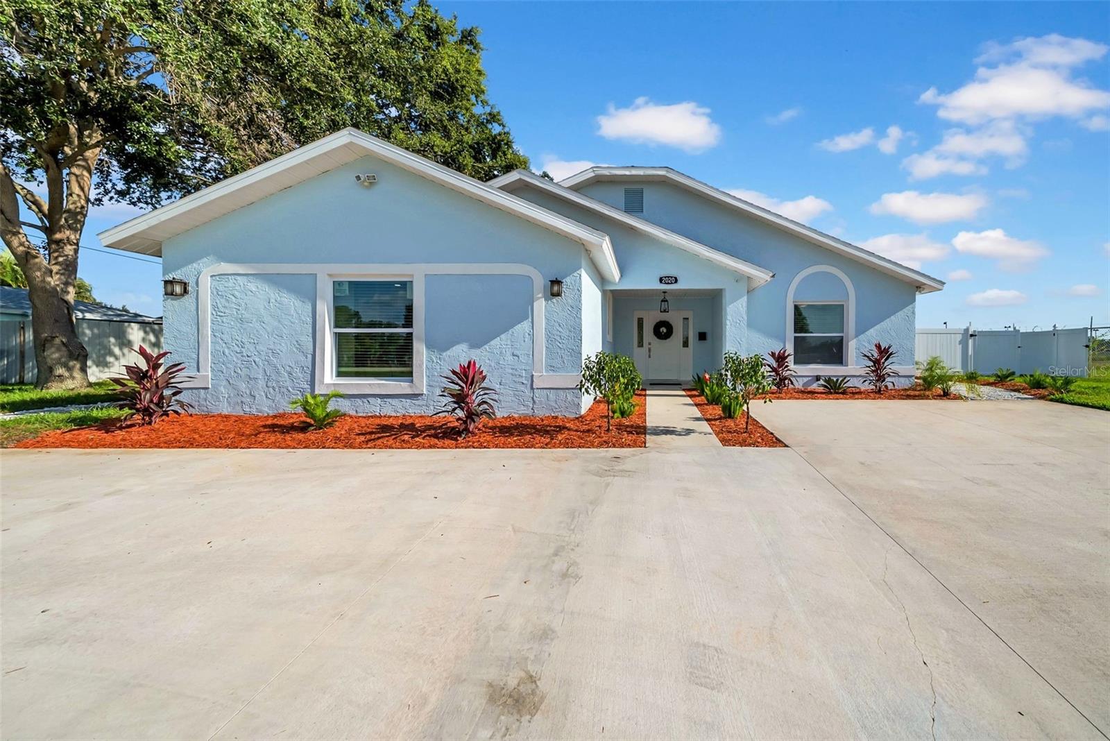 Welcome to a beautifully redesigned 3-bedroom, 3-bathroom home offering modern luxury and laid-back Florida living. Situated on a spacious corner lot, this 2025 full remodel leaves nothing untouched—with a new HVAC, impact windows, doors, electrical, plumbing, bathrooms, and a chef-inspired kitchen featuring a striking quartz waterfall-edge island. Porcelain tile flooring runs seamlessly throughout the open-concept layout, creating a sleek and cohesive feel. The kitchen is the heart of the home, ideal for entertaining with high-end finishes and all-new appliances. Step outside to your private backyard oasis with a resurfaced pool (2025) surrounded by brand-new pavers, all enclosed within a screened-in lanai for year-round enjoyment. The fully fenced corner lot offers privacy, space, and plenty of room to entertain. Park your boat within the large double gate. Located minutes from downtown St. Pete, Gulf beaches, and major thoroughfares, this move-in-ready home combines high style with everyday convenience. Near all schools for all ages. Don't miss this exceptional opportunity, schedule your private tour today!