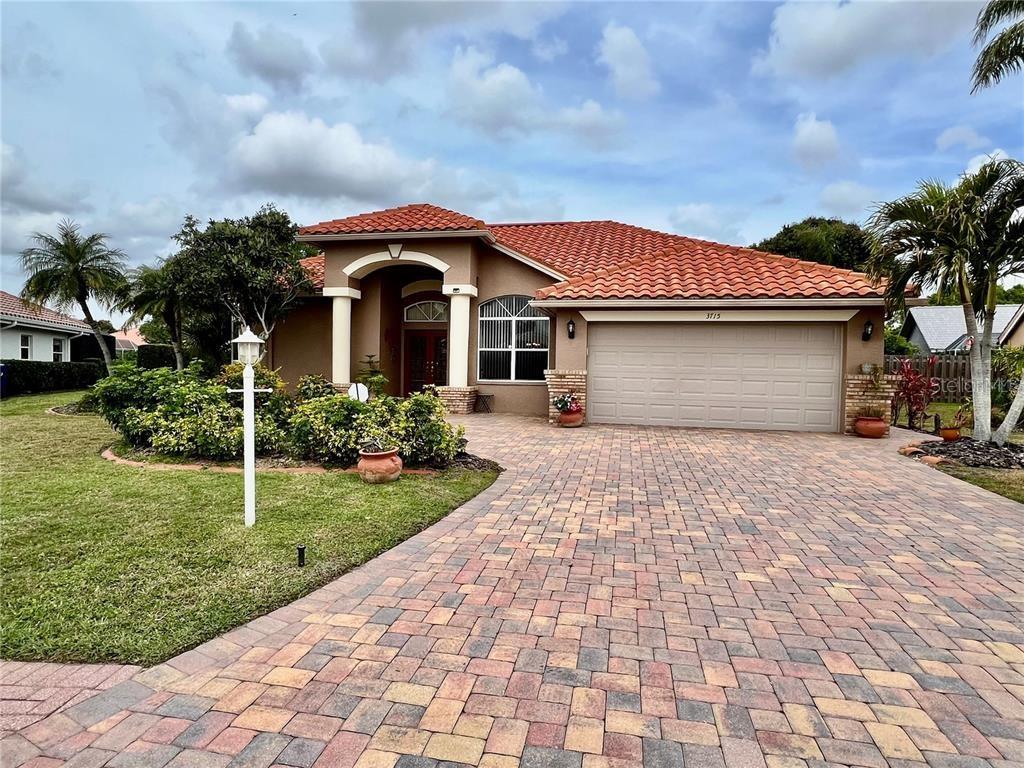 Experience the epitome of luxury living in this spacious 3 bedroom, 2 bath home with a private saltwater pool overlooking a serene lake, conveniently located near University Town Center, Sarasota Bradenton International Airport, Downtown Bradenton, and Sarasota, as well as the famous beaches of Lido and Siesta Key. The primary bath features a Jacuzzi Garden tub. Amenities include a pool situated on a lake and tennis courts. Nestled in the Trails community, you’ll be enamored by the impeccable exterior showcasing a paver driveway, expansive front porch, lush landscaping, and charming brick accents. Step inside to discover a semi-open floor plan designed for seamless entertainment, accentuated by 20” tile flooring and soaring ceilings throughout. The main living area serves as a haven for social gatherings, comprising a generous living room, formal dining area, gourmet kitchen, and cozy family room. The gourmet kitchen is a chef's delight, adorned with beautiful granite countertops, an abundance of solid wood cabinets, stainless steel appliances, and a dazzling backsplash. Retreat to the living room featuring a brick wood-burning fireplace and sliding glass doors leading out to the screened-in covered Lanai, where you'll find the private oasis of the enclosed saltwater pool with lake views. The owner’s suite is a sanctuary of indulgence, offering a spacious bedroom, walk-in closets, and a luxurious ensuite bathroom complete with dual vanities, a Jacuzzi Garden tub, and a sizable walk-in glass-enclosed shower. The remaining two bedrooms are discretely positioned away from the main quarters, ideal for families or guests. Additional highlights of this remarkable home include newer kitchen appliances and a washer, dryer, and extra refrigerator in the garage. Tenants will have access to the community pool and tennis courts. Embrace this exceptional opportunity to elevate your living experience – schedule a private showing today and make this home your perfect match for long-term rental living.
