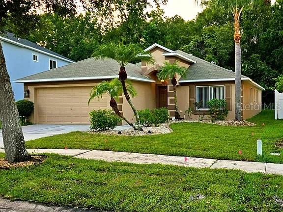 Welcome to this beautiful 4-bedroom, 2-bathroom home located in the highly desirable Grand Oaks community of Land O' Lakes. Spanning 1,962 heated square feet (2,423 total square feet), this well-designed property offers an open and spacious floor plan perfect for both comfortable living and entertaining.  The interior features a thoughtful layout with durable luxury vinyl and ceramic tile flooring throughout—completely carpet-free! The spacious kitchen flows seamlessly into the main living areas, making it the heart of the home. Additional interior conveniences include a dedicated inside laundry room equipped with washer and electric dryer hookups.  Step outside to your private yard, situated on a manageable 0.12-acre lot featuring an attached 2-car garage and a durable shingle roof. Residents of Grand Oaks enjoy a prime location zoned for excellent Pasco County schools, including Veterans Elementary, Cypress Creek Middle, and Cypress Creek High School. With a low annual HOA and no CDD fees, this home offers incredible value. Enjoy easy access to I-56, State Road 54, and all the shopping, dining, and conveniences Land O' Lakes has to offer. Schedule your showing today!
