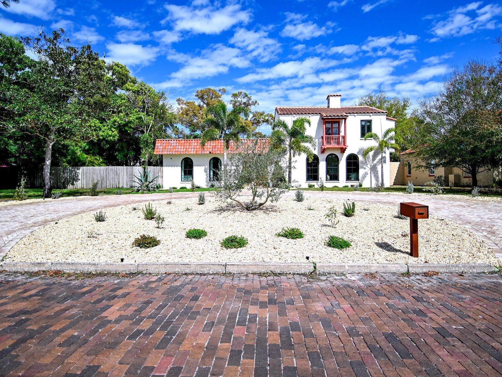 Virtually Staged. Welcome to a beautifully reimagined piece of Gulfport history in Pasadena Estates—a 1920s Spanish-Mediterranean gem on a sprawling 1/3-acre lot. Meticulously restored, this residence honors its architectural heritage w/ original arches, beamed vaulted ceilings & exquisite woodwork throughout, complemented by deco-stucco interior walls. Featuring beautiful hardwood floors alongside elegant wood-look tile, every room radiates warmth and style. W/ 3-4 beds & 2 full/2 half baths, it artfully blends thoughtful, high-end renovations for modern comfort while retaining its historic charm. Venture through the grand foyer into a sun-drenched formal parlor anchored by a classic wood-burning fireplace and handcrafted details, incl. authentic corbels & exposed beams. Entertain in elegance in the formal dining rm, which features a stunning crystal chandelier & opens through French doors to a picturesque Spanish courtyard w/ a tranquil old-world fountain. The chef's kitchen is a showstopper w/ wood cabinetry, granite counters, premium appliances incl. a new 2026 dishwasher, designer lighting & a luxurious quartz island. A spacious Butler's Pantry connects directly to a powder rm, complete w/ a well-appointed wet bar & fridge—perfect for entertaining guests or hosting special occasions. Adjacent spaces incl. a mudroom w/ updated electrical panel (2020), a 4th bed/flex rm, cleverly concealed laundry closet & half bath. The family rm features shiplap built-ins & seamless indoor-outdoor living. The sparkling saltwater pool was resurfaced less than a yr. ago, w/ a new pump & saltwater system replaced in 2023. Enjoy the lovely, landscaped grounds & a firepit set on easy-maintenance artificial turf. Upstairs, the renovated primary suite is a sanctuary, boasting a spa-inspired bath w/ Italian Carrara marble, custom glass & a designer double vanity, plus an expertly crafted dressing closet. Add'l rms retain vintage charm w/ original fixtures & a restored cast-iron tub. Recent upgrades—incl. a new 2025 roof, hurricane-rated doors, new 2nd-fl. A/C (July 2025), serviced & inspected downstairs A/C, Renewal by Andersen® windows, spray foam insulation, updated plumbing & more—ensure lasting peace of mind for buyers seeking a move-in ready, storm-ready historic home in Gulfport, FL. The property also offers natural gas—a valuable feature for buyers seeking energy flexibility & efficiency. Uninterrupted Terminix pest control service since purchase provides an additional layer of protection and confidence for the next owner. The current owners beautifully redesigned the front w/ landscaping & brick pavers, creating a welcoming circular drive & convenient guest parking. The detached 2-car garage offers the owners exclusive rear-entry access—perfect for added privacy and ease—and is equipped w/ 2 add'l electrical panels. All of this is just mins. from Gulfport Beach, St. Pete Beach, Pasadena Yacht & Country Club & downtown St. Petersburg. Nestled in the heart of Gulfport, FL—known for its small-town charm & vibrant local culture—enjoy tree-lined streets, art galleries, shops & eateries. Gulfport Beach and the Recreation Center are nearby for swimming & kayaking, and parks offer scenic views & outdoor activities. Year-round events like art fairs & farmers' markets, Maynard Duryea Bayview Park & Treasure Island Beach are just a short drive away.