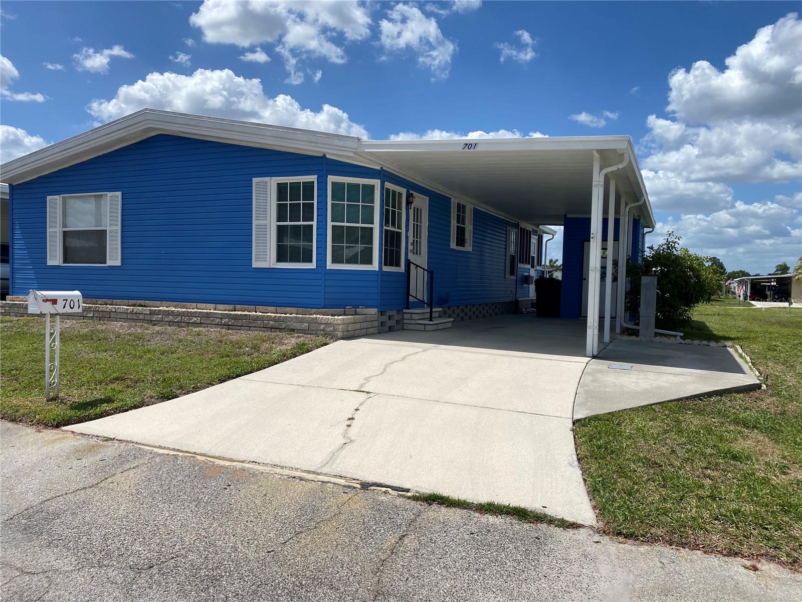 Back on the Market, No fault to the seller. Home is ready for it's next buyer!! Welcome to 701 Riverview Circle located in the boating community of Harbor Cove. This home offers a 2-bedroom, 2 bath, Doublewide home  in a 55+ Community. As you enter the home you are greeted by a beautiful fixed bay window that makes a perfect breakfast room just off of the kitchen. The kitchen and dining area are bright and spacious. This home boasts a large master bedroom with master bath. Entertain guests on the enclosed sun room. The community features a newly remodeled clubhouse and marina, 2 swimming pools, a library, a fitness room, tennis courts, pickleball & bocce courts, several craft rooms and a wood working shop. You are close to shopping, dining, entertainment, numerous golf courses, sports facilities, and SW Florida's renowned beaches. Come take a look!