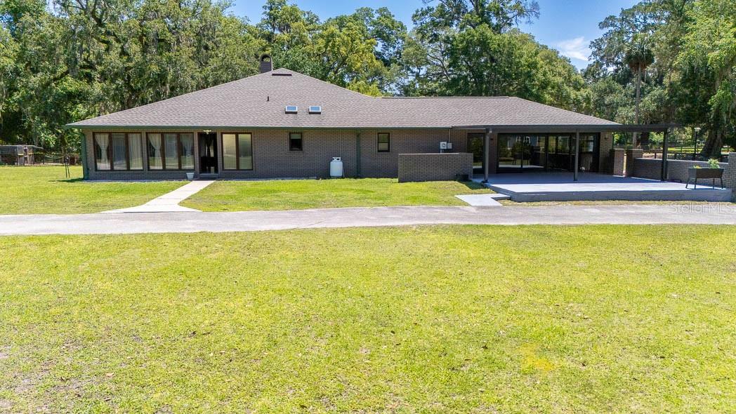 Welcome to your private countryside retreat in the heart of Central Florida. Nestled on just over 5 beautifully usable acres, this exceptional property offers more than 5,000 sq. ft. of living space designed for comfort, entertaining, and country living at its finest.

Featuring 4 spacious bedrooms and 4 full bathrooms, the home showcases a large country-style kitchen, a dedicated enclosed office, a stunning stone fireplace, and an impressive indoor pool perfect for year-round enjoyment. Recent updates include a new shingle roof (2021), all new A/C systems (2021), upgraded electrical panels.

Equestrian and hobby enthusiasts will appreciate the full-size workshop, 2-stall horse barn with tack room, fenced areas for livestock, and expansive outdoor space with endless possibilities.

Conveniently located just minutes from The Villages, Oxford Downs, I-75, and the Florida Turnpike, offering easy access to both Orlando and Tampa in approximately an hour.

 A rare opportunity to own a move-in-ready estate combining privacy, functionality, and prime Central Florida location.