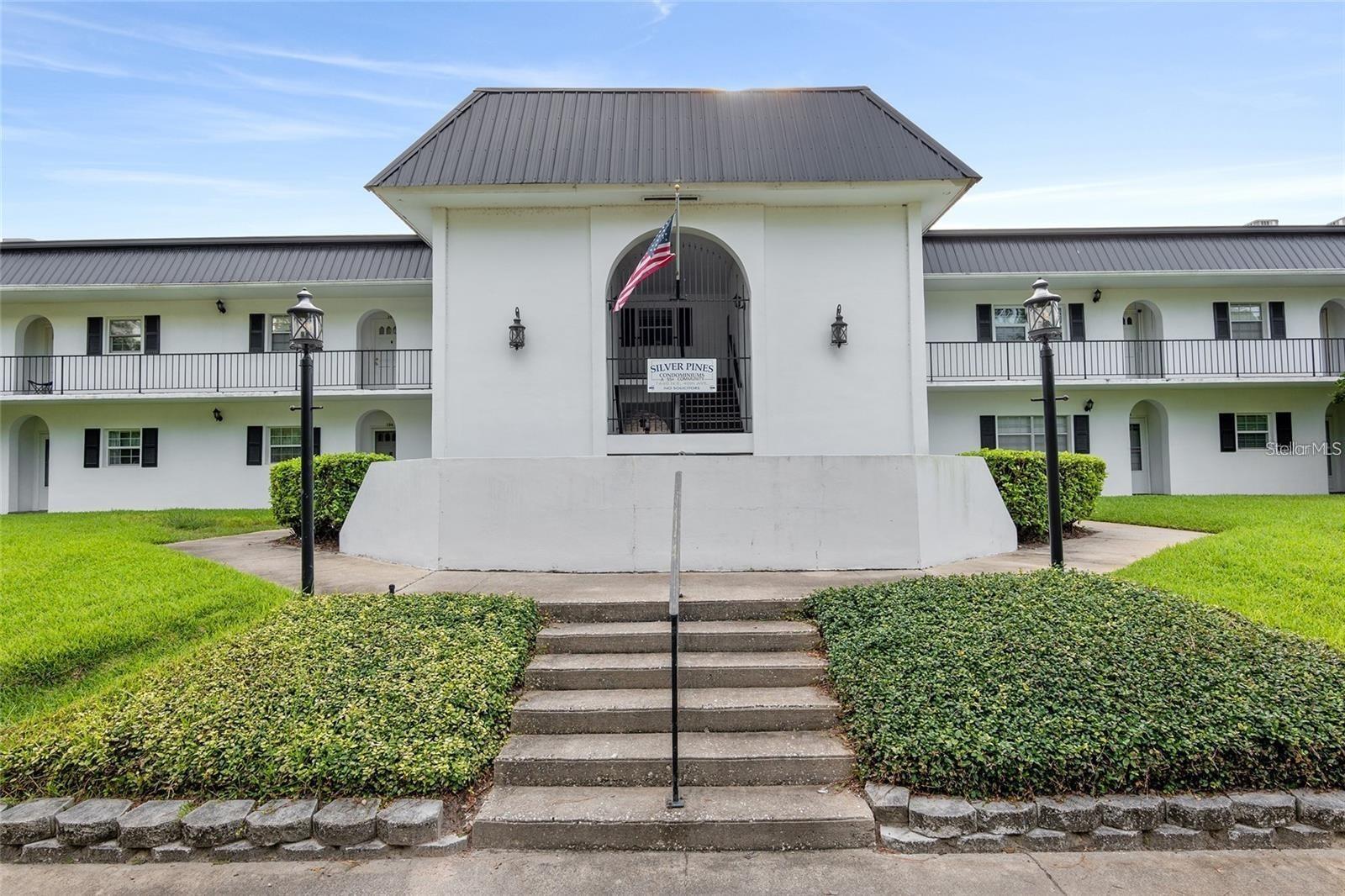 Wonderful 1/1 condo in a great NE Ocala location. The 55+ Silver Pines Condominiums features a large pool with a covered outdoor entertainment area perfect for friends and family. This condo has been fully renovated. There is a larger living room / dining room combo area with a pass-thru from the kitchen to the living room. The kitchen features quartz countertops, wood cabinets with ample storage space. The bedroom has a large closet with built-in vanity and built-in storage with a connected walk-in closet with cedar ceiling. There is also French Doors that lead out the screened-in balcony overlooking the pool area. The building has an elevator for easy access to the second floor. There is assigned covered parking and plenty of visitor parking. The HOA Fee also includes Trash, Water, Insurance, Common Area Taxes, Painting, Maintenance and Repair (exterior building only). Residents enjoy exclusive access to community amenities such as a swimming pool, sundeck, cabana, outdoor grill, outdoor showers, and laundry facilities. Across the street, a serene park invites you to unwind with scenic walking trails and a fitness station. Perfect for reconnecting with nature right outside your doorstep. Less than a mile to world famous Silver Springs State Park with kayaking, glass bottom boats and nature trails. This condo is close to everything Ocala has to offer. Must see!