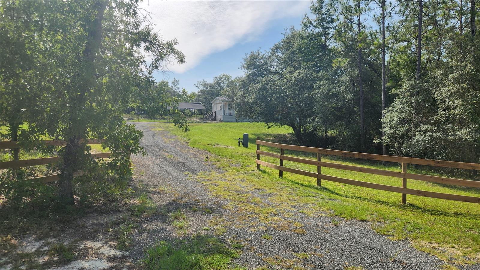 Don't miss this beautifully maintained 2021 doublewide manufactured home situated on 1.25 acres in the desirable Williston Highlands subdivision in Morriston, FL. Offering 3 bedrooms, 2 bathrooms, and 1,242 square feet of living space, this home is exceptionally clean and in excellent condition. The open floor plan features a spacious living area, a well-appointed kitchen with stainless steel appliances, and a dedicated laundry room complete with washer and dryer. Enjoy your morning coffee or unwind in the evenings on the covered 6' x 14' front porch. With plenty of room to spread out and enjoy country living, this move-in ready property offers the perfect blend of comfort, privacy, and convenience. Schedule your showing today!