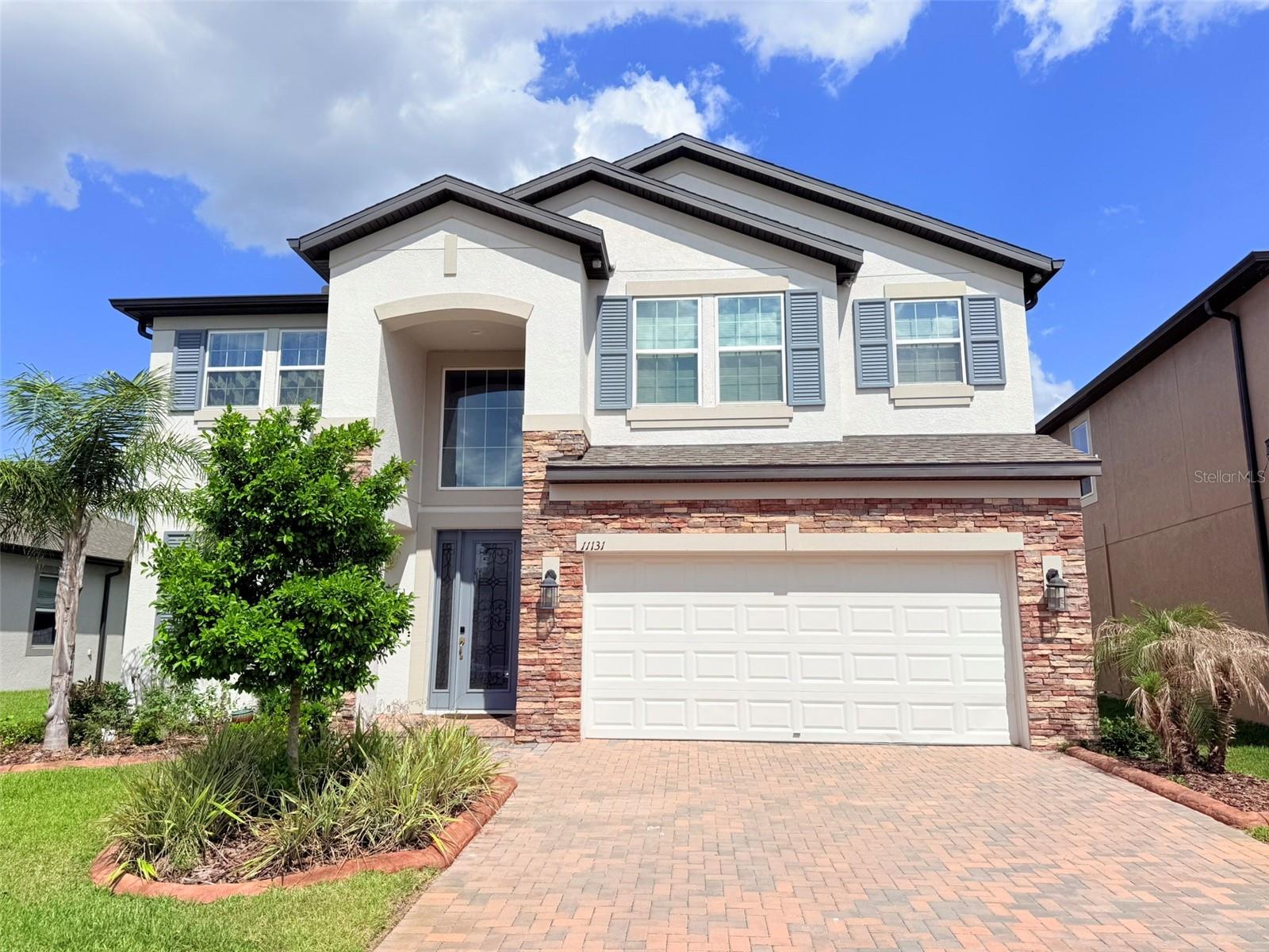 Welcome to 11131 Sundrift Drive, a spacious and upgraded 5-bedroom, 3-bathroom two-story home with a 3-car garage located in the highly sought-after K-Bar Ranch community of Tampa. Step inside to a bright foyer with soaring ceilings and a versatile flex room perfect for a home office, playroom, formal dining area, or sitting room. The open-concept kitchen, dining area, and family room create the perfect space for everyday living and entertaining. The kitchen features a stunning waterfall island, stainless steel appliances, a gas stove, ample cabinetry, and a pantry with custom shelving. Sliding glass doors lead to an oversized covered lanai, ideal for relaxing, outdoor dining, or hosting guests. The first floor also includes a private guest bedroom and full bathroom, perfect for visitors or multi-generational living, along with a convenient laundry/utility room. Additional storage space under the stairs provides extra room for organization.

Upstairs, enjoy a spacious game room/loft that makes an ideal second living room, media room, play area, or home workspace. The oversized primary suite offers plenty of room for a king-size bedroom set, sitting area, or additional workspace, creating a true private retreat. The spa-inspired primary bathroom features dual vanities, a separate soaking tub, walk-in shower, private water closet, and a large custom walk-in closet with built-in shelving. The second floor also includes three additional generously sized bedrooms with ample closet space, including custom closet systems in select rooms, along with a full secondary bathroom designed for convenience and comfortable shared living.

This desirable New Tampa location offers convenient access to top-rated schools, shopping, dining, parks, and major highways, while offering a peaceful and well-maintained neighborhood setting. Residents of K-Bar Ranch enjoy community amenities including a pool, playgrounds, and walking trails, all just minutes from Wiregrass Mall, Tampa Premium Outlets, USF, hospitals, and I-75. This home offers the perfect blend of space, comfort, upgrades, and location.