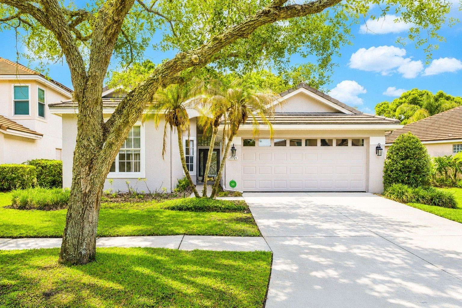 One or more photo(s) has been virtually staged. STUNNING POOL & SPA HOME located in the highly sought-after 24-hour man-gated golf community of Hunter’s Green in the premier Nathan’s Court subdivision with lawn maintenance included! This beautifully maintained single-story home is situated on a large lot with gorgeous landscaped views and offers 2,069 sq ft of luxurious living space featuring 3 bedrooms, 2 bathrooms, and an oversized 2-car garage.
Step inside and be welcomed by a fantastic open floor plan with high ceilings, beautiful new tile flooring throughout, and spacious formal living and dining areas perfect for entertaining. The spacious owner’s retreat features large walk-in closets and a beautifully updated en-suite bath with dual vanities, a large walk-in shower, and relaxing garden tub.
The updated kitchen offers plenty of cabinet space, upgraded appliances, beautiful tile backsplash, breakfast bar seating, and a spacious eat-in dining area. The kitchen opens to a large family room with sliding glass doors leading to your private outdoor oasis.
Enjoy Florida living at its finest in the oversized screened lanai featuring a gorgeous pool and spa overlooking beautifully landscaped surroundings—perfect for relaxing or entertaining family and friends year-round.
Additional features include: Tile Roof (2018), updated interior and exterior paint, new tile flooring throughout. Hunter’s Green is a master-planned golf community located in New Tampa offering incredible amenities including nature trails, parks, playgrounds, dog parks, tennis courts, soccer field, baseball/softball field, basketball court, and fitness trails. Optional golf and country club memberships are available for an additional fee. 
Conveniently located just minutes from I-75 & I-275, close to shopping, dining, hospitals, top-rated schools, USF, Moffitt, and Flatwoods Preserve. 
This is the perfect place to call home — schedule your private showing today