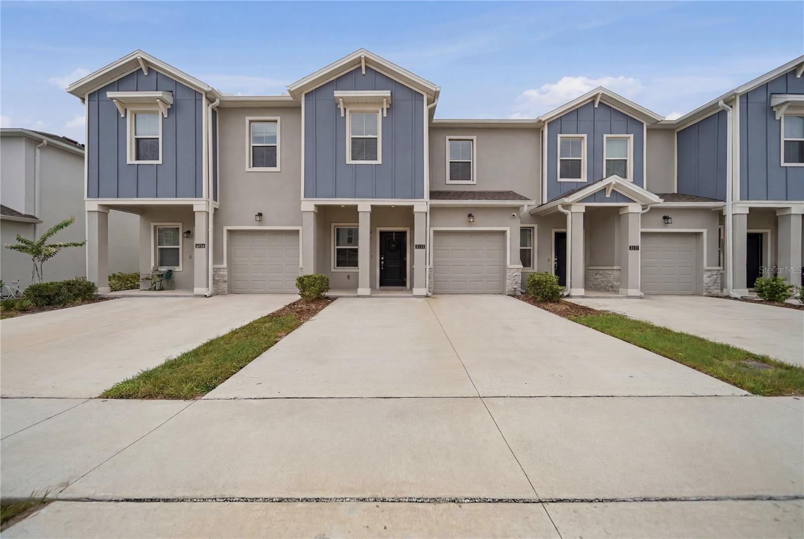 Welcome to 3161 Laurent Loop, a beautifully maintained 3-bedroom, 2.5-bath townhome located in one of Davenport's most desirable resort-style communities. Built in 2024, this move-in-ready home offers the perfect combination of modern design, low-maintenance living, and thoughtful upgrades throughout. As you enter the home, you'll be greeted by a versatile flex space that can easily serve as a home office, reading nook, play area, or additional entertaining space to fit your lifestyle. Step inside to an open-concept floor plan featuring a spacious kitchen with white cabinetry, quartz countertops, stainless steel appliances, and a large island perfect for entertaining. The dining area showcases a custom designer accent wall, while upgraded pendant lighting and ceiling fans throughout the home add both style and comfort. Upstairs, the spacious primary suite features a large walk-in closet complete with a custom closet system, providing exceptional storage and organization. The secondary bedrooms are generously sized, making this home ideal for homeowners, guests, or tenants alike.

Outside, enjoy a private patio with additional hardscape enhancements, creating the perfect space for relaxing, grilling, or entertaining. The home also offers a one-car garage plus an extended driveway that comfortably accommodates two additional vehicles.

Residents enjoy access to resort-style amenities, including a community pool, playground, pavilion, and green spaces. Conveniently located near shopping, dining, major highways, theme parks, and Central Florida attractions.

Whether you're a first-time homebuyer looking for a move-in-ready home or an investor seeking a turnkey opportunity, this property checks all the boxes.