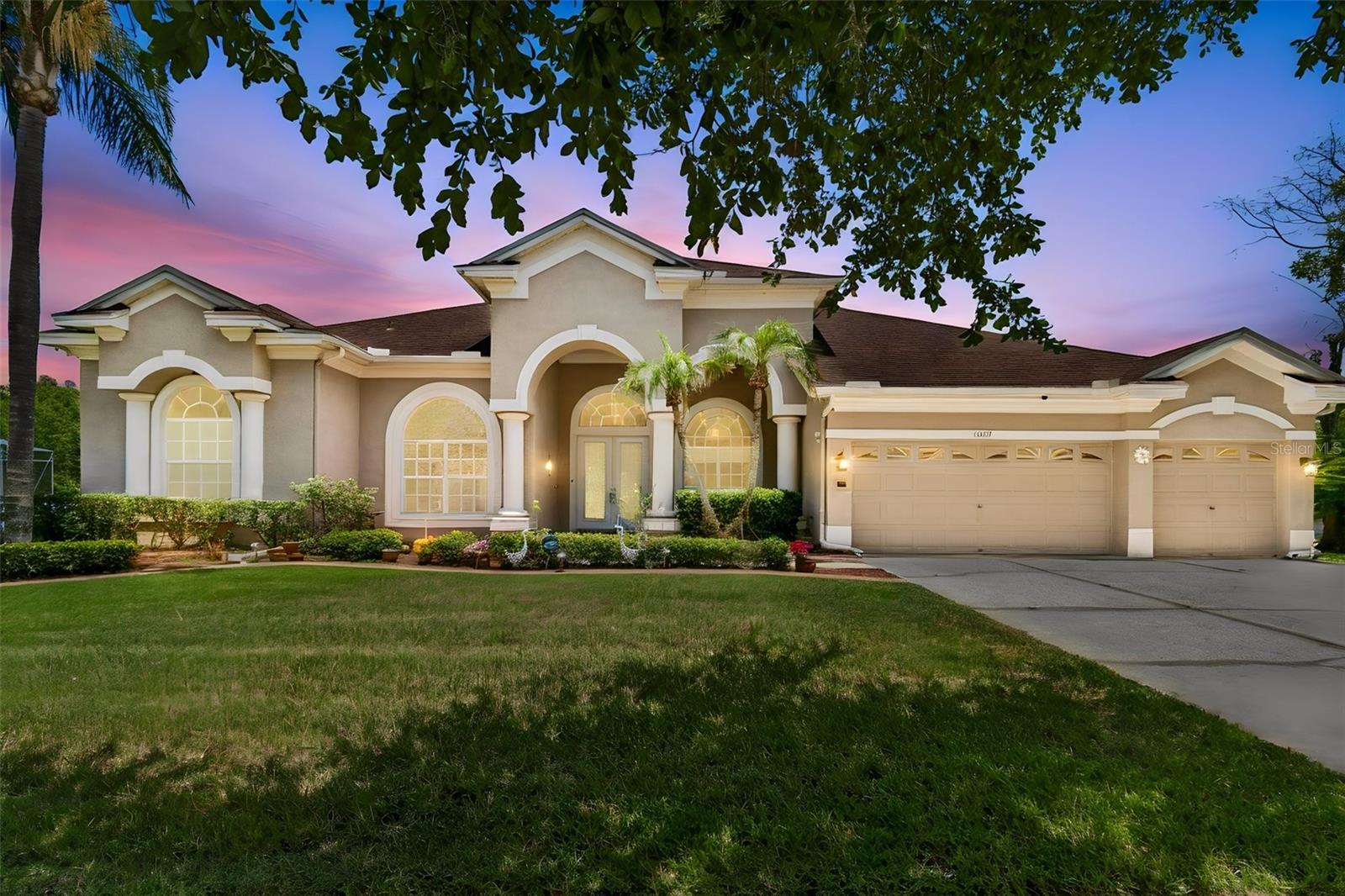 Welcome to 18107 Emerald Bay Street — a rare estate opportunity nestled in one of Tampa's most sought-after master-planned communities, Heritage Isles Golf & Country Club. Tucked at the end of a
quiet cul-de-sac and perched directly on the 10th hole of the championship golf course, this exceptional residence offers pond views, breathtaking sunrise and sunset views, and a front-row seat to the community's
spectacular fireworks displays — all from the privacy of your own backyard.
Spanning 3,773 square feet, this 4-bedroom, 3-full-bath home also features a dedicated study/den, formal living room, open family room, and a 3-car garage — delivering the space and flexibility of true estate living.
East-west orientation floods the home with natural light and water views from virtually every room, while energy-efficient window film keeps utility costs in check.  Major updates have already been done for you: new roof
(2020), two Lennox HVAC units (2020), new water heater, whole-home water filtration system (2022), a fully renovated master bath featuring a luxurious Jacuzzi soaking tub (2022), and brand-new stainless steel
appliances throughout the kitchen. Soaring high ceilings add volume and grandeur at every turn. Step outside to your private screened lanai and take in the resort-style pool and spa overlooking the golf course and pond
— a view that simply never gets old. Whether you're entertaining at sunset or enjoying a quiet morning coffee, this outdoor living space is pure magic. Heritage Isles is more than a neighborhood — it's a lifestyle.
Residents enjoy access to an 18-hole championship golf course, clubhouse, resort-style pool, tennis and basketball courts, fitness center, playground, and a vibrant social calendar. All of this sits just minutes from I-75,
top-rated schools, Wiregrass Mall, Premium Outlets, AdventHealth, and the best of New Tampa's dining, shopping, and entertainment. Homes of this caliber on a lot like this simply do not come along often. Schedule
your private showing today.