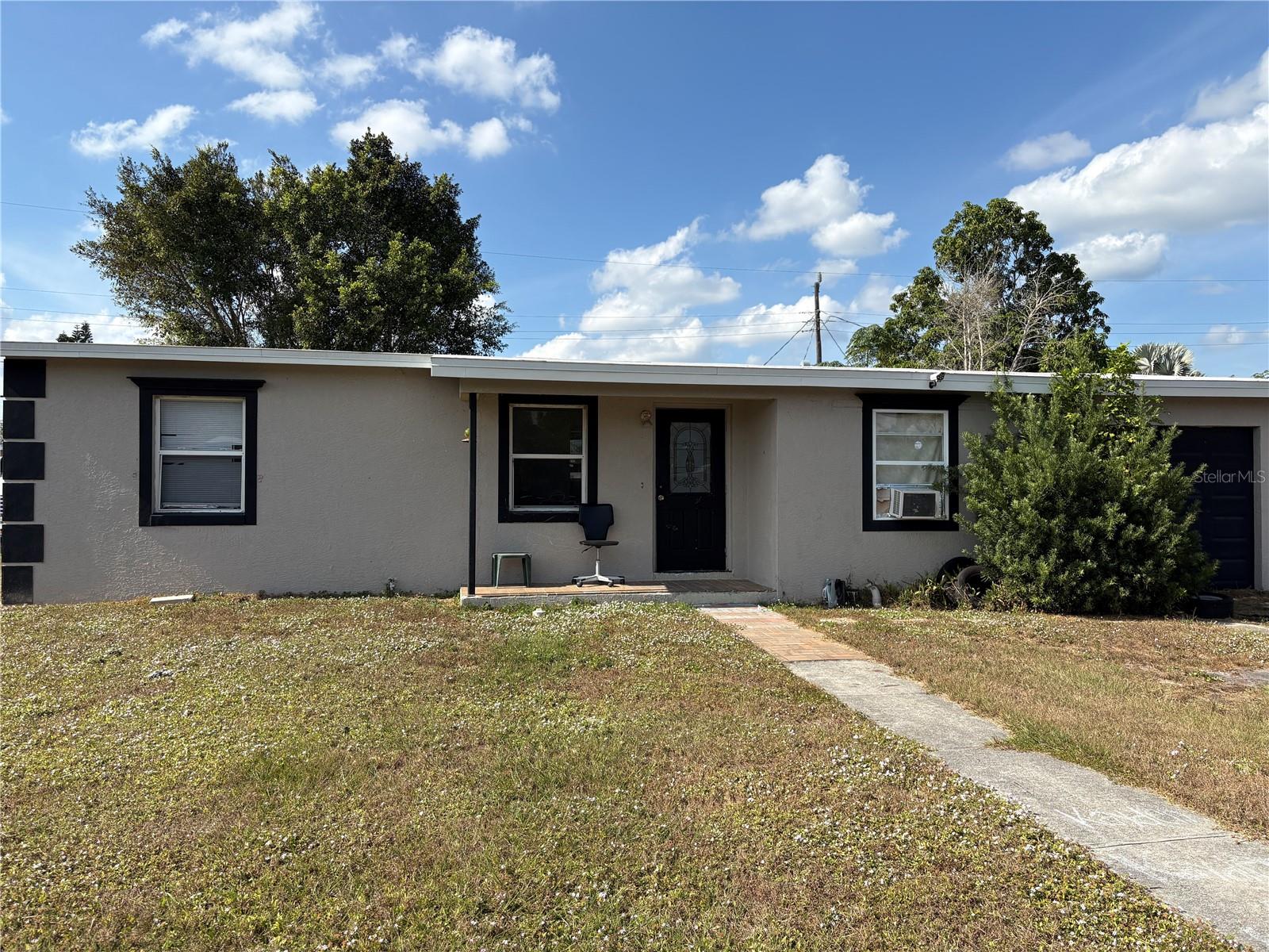 This spacious 3-bedroom, 2-bath home in North Port is a true handyman and investor special with strong potential and solid bones. The whole house is finished with large, neutral tile flooring, giving you a clean and durable base to build on. The layout feels open and bright, offering a great start for upgrades or creative redesign. The living room features crown molding and a ceiling fan, adding character and comfort. Nearby, the kitchen includes a steel refrigerator and plenty of room to rework the space into a modern and practical cooking area. The dining room opens to the screened lanai through classic French doors, giving easy access to fresh air and allowing you to expand your living space. The oversized master bedroom is another strong feature, complete with tile flooring, dual closets, and its own door to the lanai. With a tiled shower-and-tub combo and a modern wood vanity, the master bathroom is ready for polish or full customization. The second and third bedrooms both include ceiling fans and tiled floors, offering simple spaces ready for upgrades. The second bathroom has a Roman-style tiled shower and extra storage, giving plenty of room for updates. Outside, the property continues to deliver value. A large shade tree brings natural cover, while two decks and a partially fenced yard offer room for projects, outdoor living, or layout redesign. The screened lanai adds even more space for relaxing or rebuilding into your ideal setup. This North Port location puts you close to schools, shopping, restaurants, and many daily needs. With tile throughout, a flexible floor plan, and desirable outdoor features, this home gives you a strong base to work from and the chance to add real value through repairs and improvements. Call today for more information and explore the possibilities this property offers!