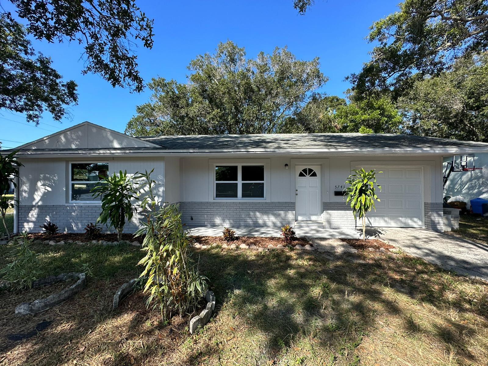Welcome to your dream home! This beautifully renovated 2-bedroom, 1-bathroom gem is nestled on a generous corner lot, offering a perfect blend of modern comforts and classic charm. Located in a tranquil neighborhood, this property is a must-see.
Fully Renovated: This home has undergone a top-to-bottom transformation. Every room has been meticulously updated to meet the demands of modern living while preserving its original character. New roof, new windows, new garage door and motor, new kitchen, renovated bathroom, new luxury vinyl planks, new paint in and out, new water heater and HVAC system! The two bedrooms are flooded with natural light and offer ample space for relaxation. The large windows provide a view of the beautiful corner lot. Gleaming Bathroom: The renovated bathroom boasts contemporary fixtures and stylish tile work, creating a spa-like retreat for your daily routines.
The open living area features hardwood floors, a cozy fireplace, and large windows, creating a warm and inviting ambiance. It's the perfect space for entertaining or quiet nights at home. The attached one-car garage ensures that your vehicle is protected from the elements, and it also provides extra storage space.The corner lot provides a spacious backyard that's perfect for gardening, outdoor dining, or simply relaxing. You have endless possibilities to create your own oasis. Situated in a quiet, friendly neighborhood, you'll enjoy a sense of community while remaining close to all the conveniences of city living. Schools, parks, shopping, and dining are all just a stone's throw away. Don't miss your opportunity to make this fully renovated home your own. With its modern amenities, ample outdoor space, and prime location, it's a rare find in today's market. Schedule a viewing today to experience the charm and comfort of this delightful property. Your new home awaits!