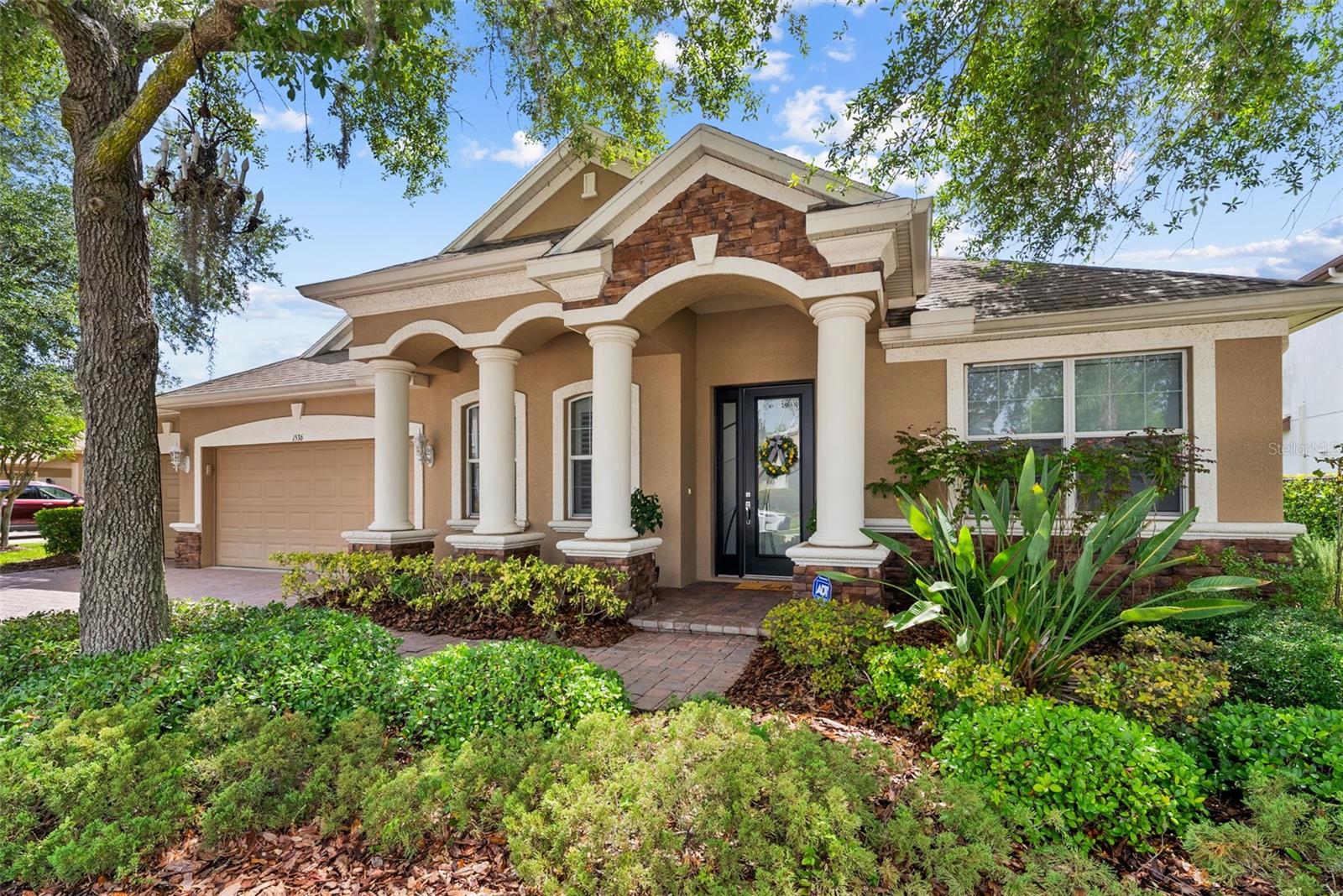 From the moment you arrive, 1536 Abyss Dr. feels special. Nestled inside the esteemed GATED COMMUNITY of Grey Hawk at Lake Polo in beautiful Odessa - and ZONED to A-RATED Middle school (Seven Springs Middle) and High School (J.W. Mitchell High) - this beautiful 3,109 SF 4 BR/3.5 BA/3-Car Garage executive-style home welcomes you with a PAVERED DRIVEWAY, elegant curb appeal, peaceful pond views, and a private outdoor retreat designed for true Florida living. With a CUSTOM POOL, CUSTOM SPA, LARGE COVERED/SCREENED LANAI (a must have in Florida!), soaring CATHEDRAL CEILINGS, and the PERFECT FLOOR PLAN (see detail below). Impressive and comfortable, this home offers a place to gather, unwind, entertain, and create wonderful memories. THE PERFECT LAYOUT: Downstairs – SPLIT PLAN EXPANSIVE PRIMARY SUITE, secondary bedrooms separately positioned on the opposite side of the home for owner privacy, a HOME OFFICE at the front of the house, and OPEN FLOOR PLAN with the BEAUTIFUL KITCHEN open to the family room and dining room; Upstairs - a HUGE bonus room with its own half bath - perfect for a media room, game room, guest space, fitness area, or second work-from-home zone. CUSTOM KITCHEN: Beautifully updated with a unique ILLUMINATE/TRANSLUCENT STONE ISLAND, 42-inch raised-panel cabinetry with crown molding, glass-front cabinets with interior accent lighting, built-ins, updated hardware, stone countertops, oversized DEEP FARMHOUSE SINK, updated plumbing and lighting fixtures, and newer appliances. Gorgeous REAL WOOD flooring in the foyer, dining room, office, family room, and kitchen adds warmth, while cathedral ceilings bring in volume, light, and an impressive sense of space. TRUE FLORIDA LIVING.  Step outside to a CUSTOM SCREENED POOL AND SPA with pavered deck, covered lanai, waterfall feature, and serene pond views. HEATED  POOL/SPA (propane) allows you to enjoy this private outdoor retreat during Florida’s cooler months. Whether you are hosting friends, relaxing after work, or enjoying a quiet morning by the water, this backyard feels like your own private resort. ADD’L IMPROVEMENTS: Custom-built solid wood entertainment center-living room, higher-end chandeliers throughout the home, updated fans-living room/front office/primary bedroom/upstairs bonus room and NEW HVAC system installed in 2025. AFFORDABLE LUXURY: Located in FLOOD ZONE X with NO CDD fee, LOW HOA FEE which includes park, playground, tennis/pickleball court, dog park.  GREAT LOCATION: Close to SR 54, Suncoast Parkway, Trinity medical corridor, Starkey Ranch District Park, shopping, dining, Tampa Premium Outlets, and everyday conveniences. More than a home, this is a private pond-front retreat with the space, updates, outdoor lifestyle you will love. SCHEDULE YOUR PRIVATE SHOWING TODAY!