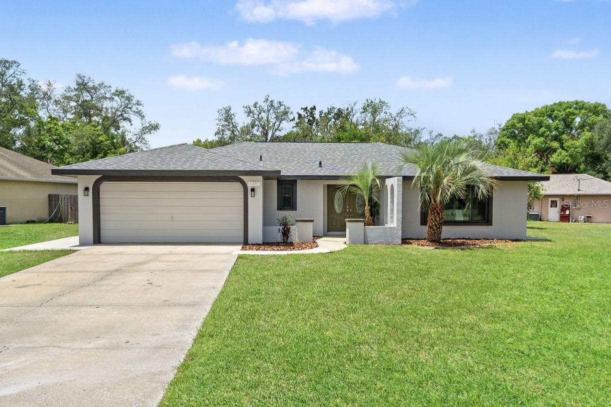 Move-in ready POOL HOME in the heart of Spring Hill! This beautiful 3-bedroom, 2-bath home with a dedicated office/flex space sits on a spacious 0.40-acre corner lot! Inside, you'll find an open split-bedroom floor plan with no carpet throughout, fresh interior and exterior paint, an inside laundry room, and major updates already completed, including a (2022) ROOF, BRAND-NEW water heater (2026), and A/C (2018). The kitchen features granite countertops, a breakfast bar, and newer appliances, making it the perfect space for everyday living and entertaining. The spacious primary suite offers a walk-in closet, an en-suite bathroom with a large walk-in shower, and sliding glass doors leading directly to the pool. Two generously sized guest bedrooms, a full guest bath with a tub/shower combination, and a versatile office/flex room that could also be used as a pantry or additional storage complete the interior. Step outside to the expansive screened lanai and enjoy Florida living year-round. Whether you're relaxing by the sparkling pool, hosting friends and family, or designing the backyard oasis you've always envisioned, this outdoor space offers endless possibilities! With NO HOA, NO flood zone, and a convenient location close to shopping, dining, schools, parks, and the Suncoast Parkway, this home checks all the boxes. Schedule your private showing today!