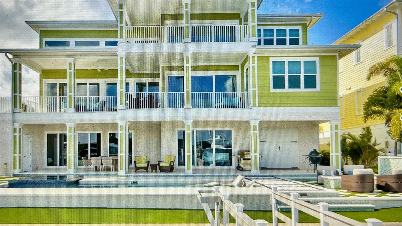Welcome to your dream home! This stunning property boasts four bedrooms and four and a half bathrooms, providing ample space for you and your family. Enjoy the ultimate relaxation in your private pool and spa, surrounded by lush landscaping and serene waterfront views. Take in the picturesque scenery from your rear porch, perfect for entertaining or unwinding after a long day. Safety meets elegance with high-quality impact windows and doors, which provide peace of mind and energy efficiency. Boating enthusiasts will fall in love with the 20,000 lb capacity boat lift for up to 30 ft, accompanied by a dock, making this property a boater's dream. The roof is only 6.5 years old, which ensures longevity and durability. Privacy is paramount with a fully fenced yard, creating a secluded haven for residents. Enjoy environmentally conscious living with reclaimed water usage. This prime location in Clearwater offers not just a residence but a lifestyle, with convenient access to the area's best amenities, schools, and entertainment options. Wake up to awe-inspiring sunrises and drift off to sleep with the tranquil sounds of the water. The waterfront lifestyle is waiting for you. Enjoy the convenience of a boat lift, a dock for your watercraft, and ample parking with a garage. This is more than a home; it's a statement of luxury living. Don't miss the opportunity to make this waterfront gem your own. Bedroom Closet Type: Walk-in Closet (Primary Bedroom).