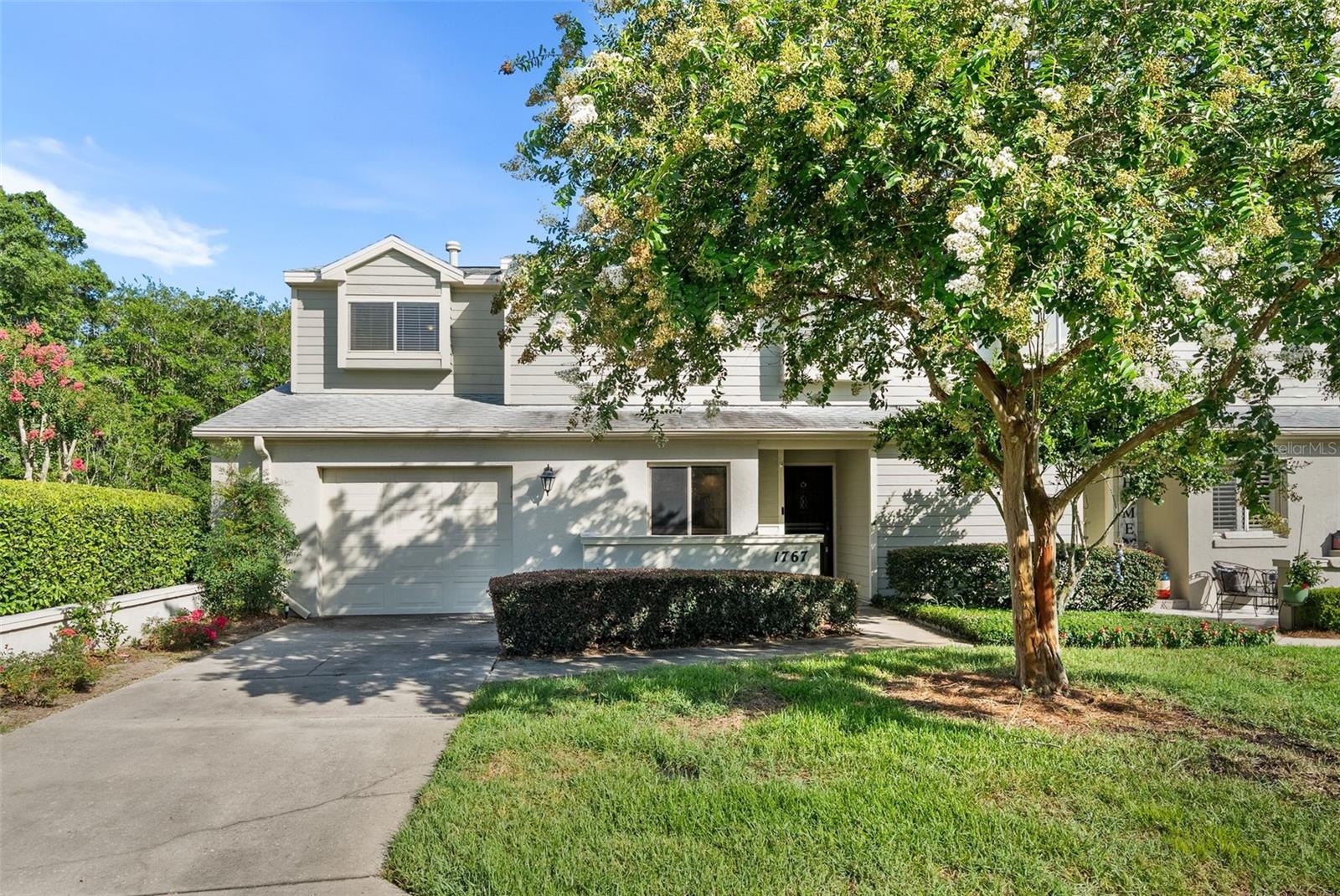 Welcome to this beautifully designed 3-bedroom, 2.5-bath, two-story home offering the perfect blend of comfort, functionality, and low-maintenance living in the heart of Ocala. Thoughtfully designed with an open and inviting layout, this home is ideal for both everyday living and entertaining.

The spacious living room features a stunning brick fireplace that serves as the focal point of the home and flows seamlessly into the dining area, creating a warm and welcoming atmosphere. The well-appointed kitchen offers an abundance of cabinetry and countertop space, stainless steel appliances, recessed lighting, a generous walk-in pantry, and a convenient pass-through opening overlooking the dining and living rooms, allowing you to stay connected while preparing meals. A cozy breakfast nook provides the perfect spot to enjoy your morning coffee.

The oversized primary suite is conveniently located on the first floor and serves as a private retreat, complete with an ensuite bathroom featuring a relaxing garden tub, separate walk-in shower, and plenty of space to unwind. Upstairs, you'll find a versatile loft with built-in shelving and upper windows that fill the space with natural light, making it ideal for a home office, media room, or play area. The two spacious secondary bedrooms are connected by a convenient Jack-and-Jill bathroom, providing both privacy and functionality.

Step outside to the expansive screened and covered lanai with tile flooring, creating the perfect space for year-round outdoor dining, relaxing, or entertaining guests. Additional storage is plentiful with space beneath the staircase and in the attached one-car garage.

Residents enjoy access to community amenities including a clubhouse and swimming pool, while the HOA provides exceptional value by covering exterior lawn maintenance, pest control, and community amenities, allowing for a truly low-maintenance lifestyle.

Perfectly situated in the heart of Ocala, this home places you just moments from restaurants, charming cafés, boutique shopping, scenic walking trails, parks, downtown Ocala, and top-rated schools. Enjoy the convenience of having everything you need just minutes away while coming home to a peaceful, well-maintained community. Don't miss your opportunity to own this exceptional home in one of Ocala's most desirable locations.