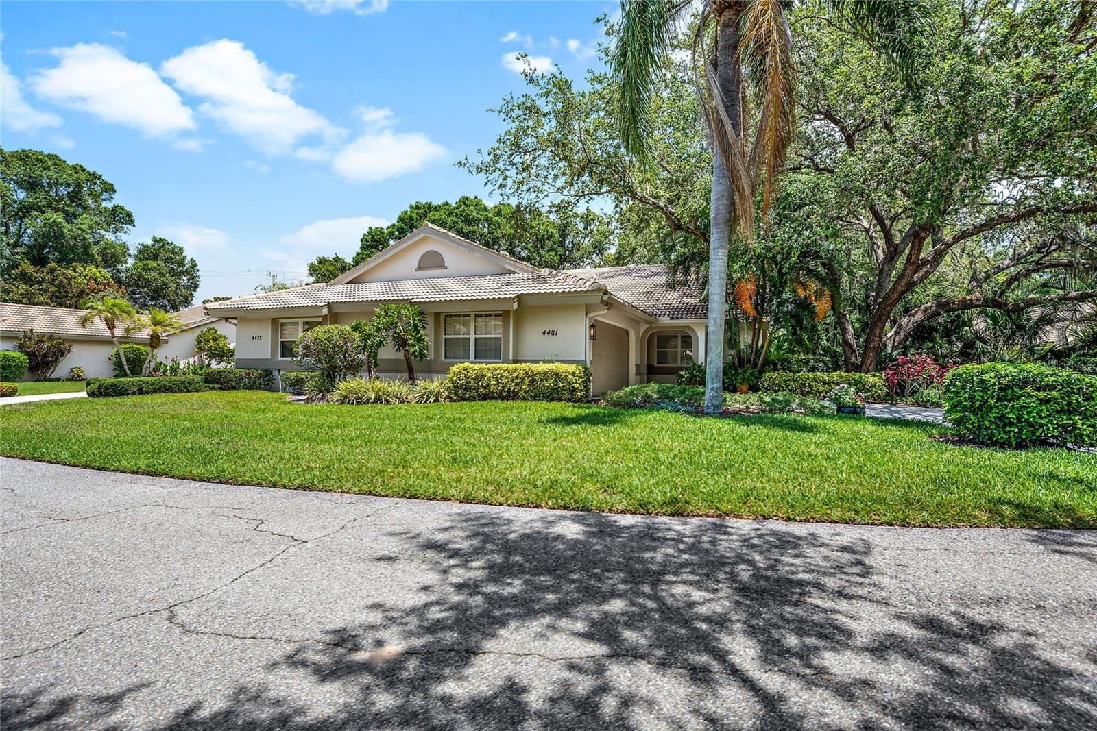 Welcome to Tivoli Village—an exclusive, private community of just 100 residences nestled among mature trees and lush landscaping. This beautifully maintained 2-bedroom, 2-bath villa with a den/office and 2-car garage offers the perfect blend of tranquility and convenience. Step inside this home peacefully knowing the major concerns have been upgraded a NEWER ROOF, A/C 2023, WATER HEATER 2023, EXTERIOR PAINT IN 2023 AND NEW BACKFLOW METER IN 2026. Seller is offering a $3000 CREDIT for HOA fees!  Ideally located near UTC shopping and dining, I-75, Nathan Benderson Park, Sarasota-Bradenton International Airport (SRQ), and just a short drive to downtown Sarasota and Gulf Coast beaches.

Step inside to an open-concept floor plan featuring soaring cathedral ceilings, abundant natural light, and seamless flow between the kitchen, dining, and living areas—perfect for both everyday living and entertaining. The updated kitchen showcases newer stainless steel appliances, ample cabinetry with slide-out shelving, a breakfast nook, and an extended breakfast bar overlooking the main living space. Sliding glass doors lead to an enclosed lanai, with additional paver patio space extending into a private, tropical outdoor retreat complete with native Florida landscaping and a custom tiled table and seating area.

The spacious primary suite is privately situated at the rear of the home and features an updated en-suite bath with dual vanities, granite countertops, and a walk-in shower with built-in bench. A split-bedroom layout ensures privacy for guests, with a secondary bedroom and full bath located at the front of the villa. The versatile den/office includes a skylight and closet, making it ideal for a home office or potential third bedroom.

Tivoli Village residents enjoy a scenic setting with four spring-fed lakes, fishing opportunities, majestic oak trees, and a tranquil nature trail. The HOA provides exceptional value, covering major expenses such as property insurance, exterior maintenance (including power washing and painting), roof replacement and repairs, as well as lawn care and irrigation—delivering low-maintenance, worry-free living.

Don’t miss this opportunity to own a move-in-ready villa in one of Sarasota’s most charming and conveniently located communities!