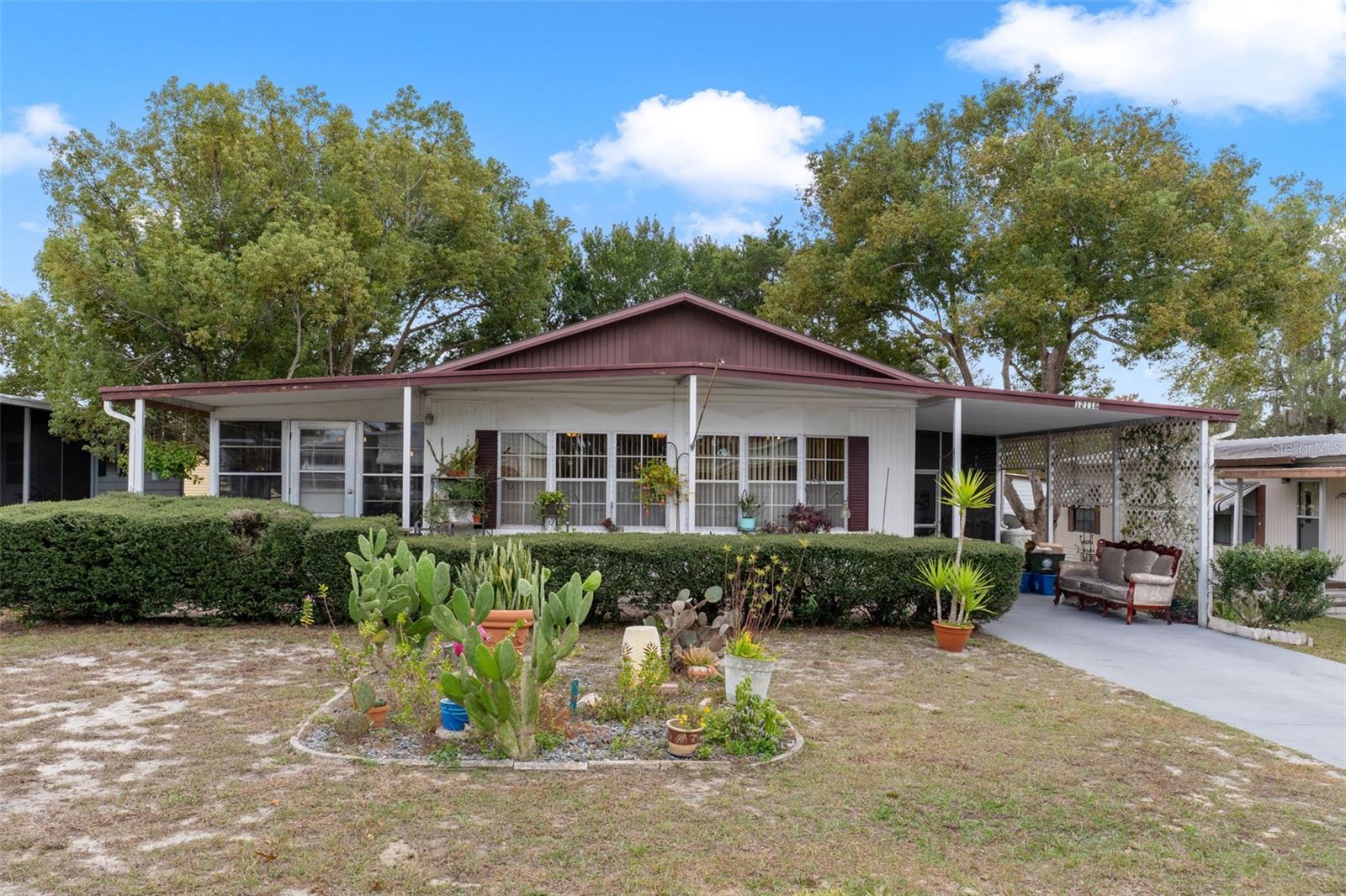 Spacious 2-bedroom, 2-bath home featuring high ceilings and an open floor plan designed for comfortable living and entertaining. The updated kitchen offers a charming breakfast nook and ample countertop and cabinet space. Both bedrooms are generously sized, providing flexibility and comfort. Enjoy year-round relaxation in the enclosed Florida room, plus a screened patio overlooking the yard—perfect for outdoor enjoyment. Located in the vibrant & active 55+ High Point Golf Community that offers tons of amenities such as Golf, tennis, pickleball, heated pool, social events and so much more. High Point is located close to shopping, restaurants, entertainment, and medical facilities. Low HOA fees and you OWN YOUR OWN LAND.