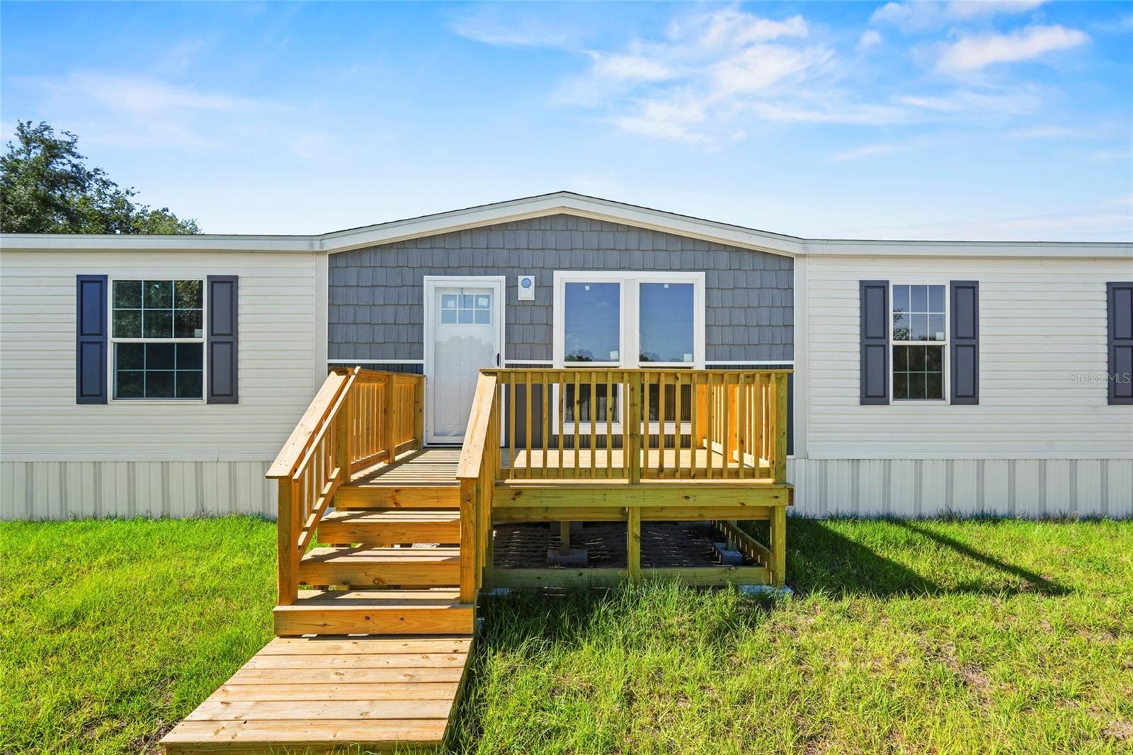 Seller will pay up to $8,000 towards closing costs! Brand New 3BR/2BA Home on 1.25 Acres in the Prairie/Viking area – Move-In Ready!Ready! This beautifully upgraded 1,493 SqFt Champion Embrace home features a modern split floor plan with warm wood tones, accent walls, and stylish contemporary finishes throughout. The spacious kitchen includes a large island, built-in microwave, coffee bar, and contrasting countertops. A dedicated dining area flows into the inviting living room, creating an open and comfortable space for everyday living. The private primary suite offers a relaxing retreat with a standalone soaking tub, oversized shower, and double vanity. Washer and dryer package will be installed prior to closing. Additional highlights include finished drywall throughout, stainless steel appliances, black fixtures, walk-in closets, and an interior laundry room with built-in cabinets and hanging rack. Situated on a 1.25-acre AG-zoned lot, this property provides plenty of room for animals, RVs, boats, or future additions like a barn, garage, workshop, or pool. Conveniently located just a short drive from Lake Okeechobee and the City of Okeechobee for shopping, dining, and medical services. Financing options available! This home qualifies for FHA, VA, Conventional, USDA, and Non-QM lending, including programs with low down payment and no income verification options for qualified buyers. Ask about special financing options and lender incentives.