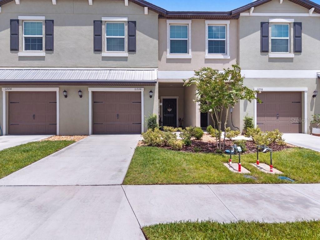 Why wait to build when you can enjoy the benefits of a nearly new home today? This beautifully maintained 3-bedroom, 2-bath townhome in Stonegate Preserve at Artisan Lakes offers modern comfort, stylish finishes, and thoughtful upgrades without the wait. Beyond the builder's impressive interior features, the sellers added custom accent enhancements that give this home its own personality and inviting charm. Even the one-car garage has been upgraded with overhead ceiling storage, creating extra space to keep everything neatly organized and out of the way. Life here is all about enjoying more and worrying less. Experience resort-style amenities without the resort-style fees, and enjoy added peace of mind knowing this home includes hurricane shutters for Florida's storm season. Perfectly positioned for convenience, you're just minutes from I-75 and the Sunshine Skyway Bridge, making commuting, weekend escapes, and Gulf Coast adventures effortless. Shopping, restaurants, entertainment, parks, and everyday conveniences are all just around the corner. Whether you're looking for your first home, downsizing, or searching for a seasonal Florida retreat, this move-in-ready townhome offers the perfect blend of style, comfort, convenience, and carefree living. The only thing missing is you!
