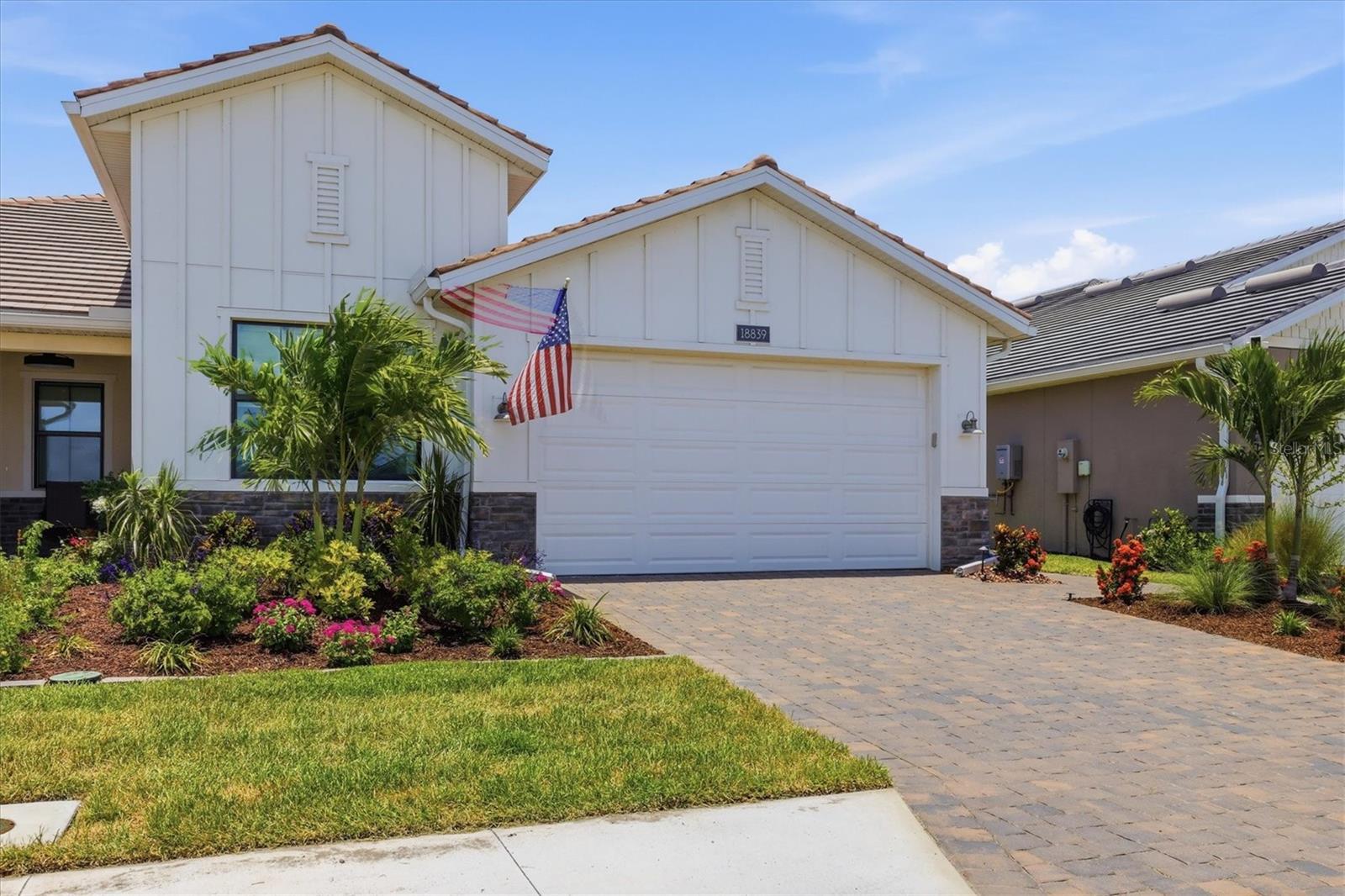 Offering the privacy and feel of a single-family home with the convenience of low-maintenance villa living, this beautifully upgraded Toll Brothers Dunnet model is an ideal fit for those seeking single-family space and privacy without the upkeep — enjoying peaceful nature views, exceptional outdoor living space, and nearly $60,000 in owner enhancements. Built in 2024, this 3-bedroom, 2-bath residence has been improved well beyond builder standards. The open-concept floor plan features tray ceilings, crown molding, custom lighting, designer window treatments, engineered hardwood flooring throughout the living areas and bedrooms, and abundant natural light. The gourmet kitchen is designed for both everyday living and entertaining, showcasing quartz countertops, premium KitchenAid appliances, natural gas cooking, a large center island, custom pantry enhancements, and ample storage. The spacious primary suite offers a spa-inspired bath with an oversized walk-in shower, dual vanities, and a professionally designed custom closet system. Quality finishes throughout create a move-in-ready living experience without the expense, disruption, or wait of new construction. Outdoor living is where this home truly shines: the screened lanai opens to an expanded paver patio surrounded by professionally landscaped grounds, mature plantings, and fencing, creating a private retreat rarely found in villa living. A generous rear buffer and tranquil nature views provide a peaceful setting to relax, entertain, and enjoy Florida's year-round outdoor lifestyle while maintaining real privacy. Built for comfort, efficiency, and peace of mind, the home includes Miami-Dade-rated PGT impact windows and doors, a concrete tile roof, insulated garage components, and enhanced attic insulation, paired with an HOA that covers lawn maintenance, irrigation, internet, cable, and resort-style amenities — including a clubhouse, fitness center, pickleball and tennis courts, and community pool. Located in Solstice at Wellen Park, just minutes from Downtown Wellen Park, CoolToday Park, dining, shopping, walking trails, and Gulf beaches, this exceptional property offers the best of Florida living in one of the area's most desirable master-planned communities.