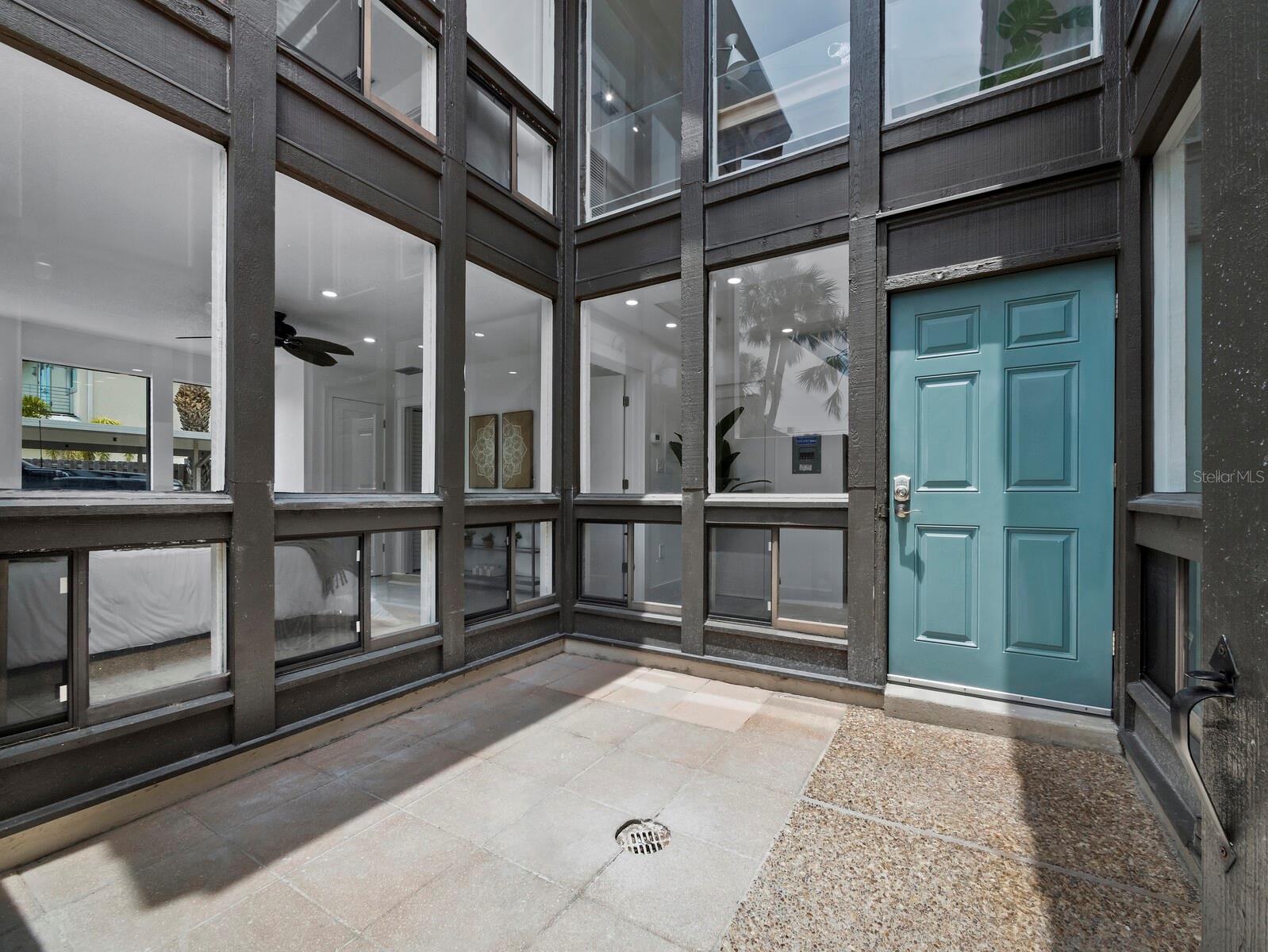 Experience the perfect blend of modern design and an unbeatable location in this meticulously renovated 2-bedroom, 2-bathroom, 2-story townhome at Embassy Villas on Lido Key. Just two blocks from the pristine sands of Lido Beach and a short stroll to the shops and dining options of St. Armands Circle, this home offers both convenience and style. Spanning over 1,090 sq. ft., this residence feels exceptionally spacious thanks to its soaring ceilings, large windows, and sleek contemporary exterior. Natural light pours in from every direction, highlighting the airy, open layout and creating a bright, welcoming atmosphere throughout. Inside, the living space is designed for both beauty and functionality. The stylish galley kitchen features all-white cabinetry, engineered stone countertops, a modern tile backsplash, stainless steel appliances, dual sinks, and under-cabinet lighting, all accented by a breakfast bar that opens to the main living area. The first-floor primary suite offers a serene retreat, surrounded by windows for an abundance of natural light, and includes a chic en suite bath with dual vanities and contemporary finishes. Upstairs, the loft-style second bedroom provides a private getaway with striking angles, abundant light, and its own well-appointed en suite bath. Embassy Villas is a boutique community offering relaxed living in one of the Suncoast’s most desirable, walkable areas. Residents enjoy easy access to the public heated pool at Lido Beach, and the home’s generous rental policy allows for two-week minimum stays up to 26 times per year. Pets are welcome, with a limit of two (up to 20 lbs. each). This townhome is an ideal seasonal retreat, full-time residence, or investment property.
