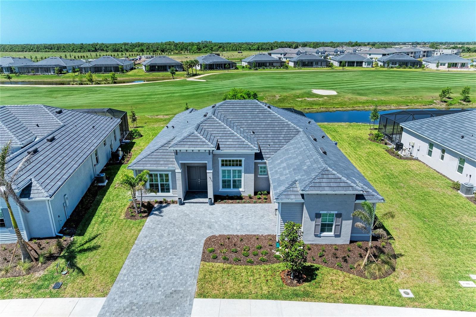 The Ultimate Turn-Key Florida Lifestyle Awaits! Not your average home, Upgrades Everywhere... Outdoor Oasis: Added kitchen with tile backsplash, steel encased TV in Lanai, hand stained ceiling trim, enhanced landscaping, saltwater pool conversion, and beautiful outdoor furniture to take it all in and relax. This home has custom Trim throughout; Accent Beams in the living room and Primary bedroom, wall accents, crown molding, redesigned island in kitchen, Murphy Bed in the Den, Window treatments with motorized shade in primary bedroom, designer light fixtures, fans, wall accents, and glass shower doors. All furniture, bedding, kitchenware, linens and accessories included in the sale of this turn key lightly used newly built home.
Welcome to your fully furnished custom dream home in the sky-high-demand Wellen Park Golf & Country Club. Completed in 2026, this masterfully designed single-family estate home combines ultra-modern luxury with the laid-back elegance of Florida’s Gulf Coast. Situated on a large 0.27-acre lot, this property is a rare find, offering unparalleled privacy, premium upgrades, and resort-style living from day one. Upgrades & Custom Features Galore! Gourmet Chef’s Kitchen: Top-tier stainless steel appliances, custom quartz countertops, an oversized eat-in island, and premium cabinetry. Voluminous Living Spaces: High ceilings, custom tray details, and soaring impact-resistant windows that flood the open-concept floor plan with natural light. Palatial Primary Suite: A private sanctuary featuring dual walk-in closets and a spa-like ensuite bath with a frameless glass shower, 2 shower heads, soaking tub and dual vanities. Outdoor Paradise: A spectacular, heated residential pool and integrated spillover spa, completely enclosed for seamless indoor-outdoor entertaining. Custom outdoor kitchen with tile backsplash, high end outdoor furniture and paneled ceilings added after market. Energy & Security: Full hurricane-impact glass, smart-home automation, and a spacious 2-car garage with epoxy flooring. World-Class Community Amenities: Living in Wellen Park Golf & Country Club means lifestyle is included. Enjoy a resort-style community pool, a state-of-the-art fitness center, tennis and pickleball courts, and fine dining at the Tiki Bar. Resort Style clubhouse coming soon! You are just minutes from the vibrant Downtown Wellen Park, pristine Gulf beaches, and top-rated local schools. Schedule your private tour today to experience this custom 2026 masterpiece in person!