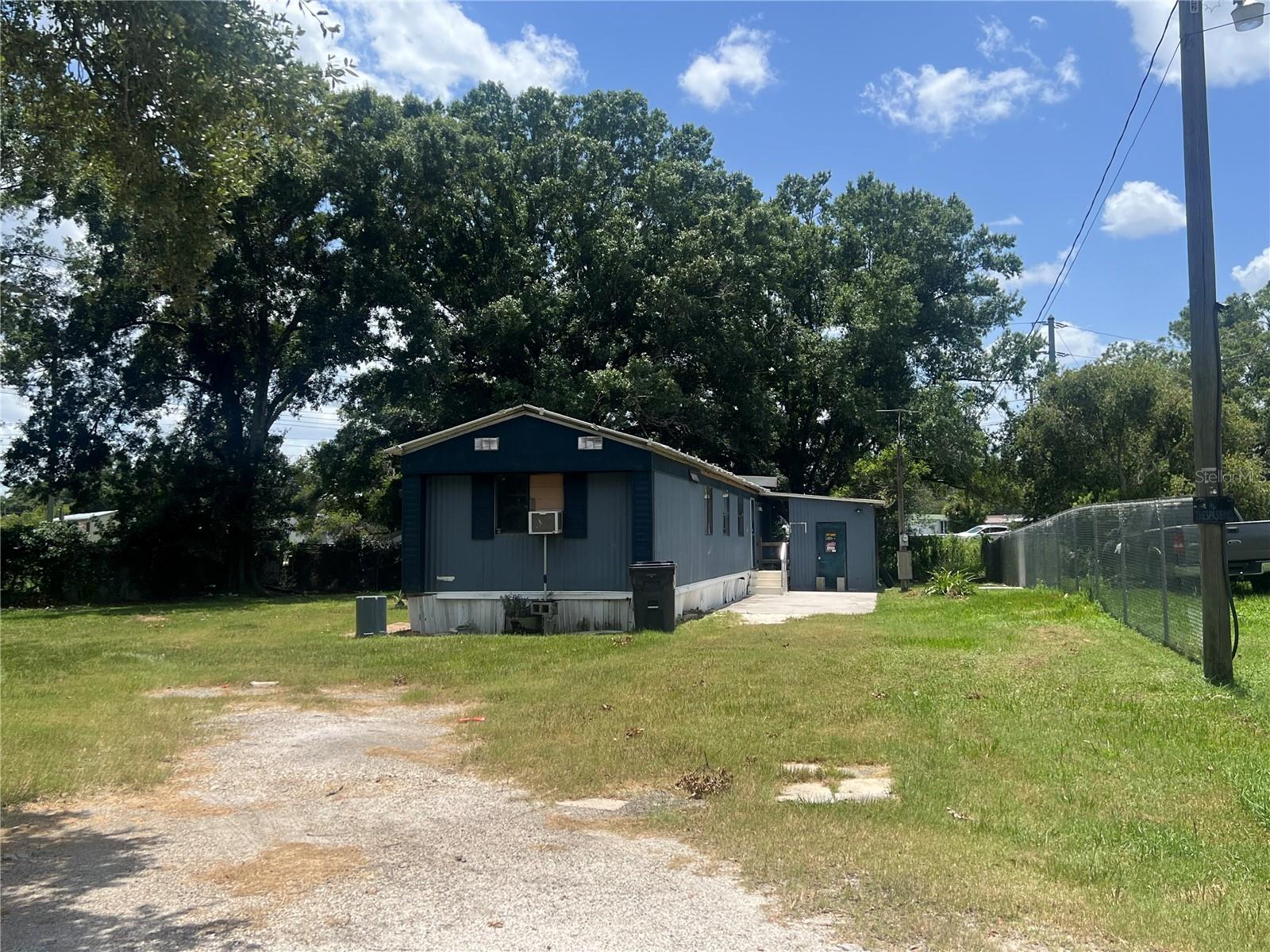 Affordable opportunity with endless potential! This single-wide mobile home sits on an oversized lot, offering plenty of space to enjoy. Move right into the existing home or build your new dream manufactured home in the future. With no HOA, you'll have the freedom to bring your boats, RVs, tailers, and other recreational vehicles. The home also features an 8'x12' screened porch perfect for relaxing outdoors. Whether you're looking for an affordable primary residence, investment property, or future homesite, this property offers exceptional value and flexibility. Schedule your showing today!