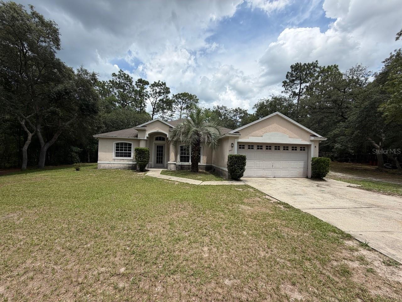 Secluded 2.5 acre parcel in Lake Helen. House offers 4 bedroom, 2 bathrooms with 2 car garage. House needs work and it is being sold AS-IS.