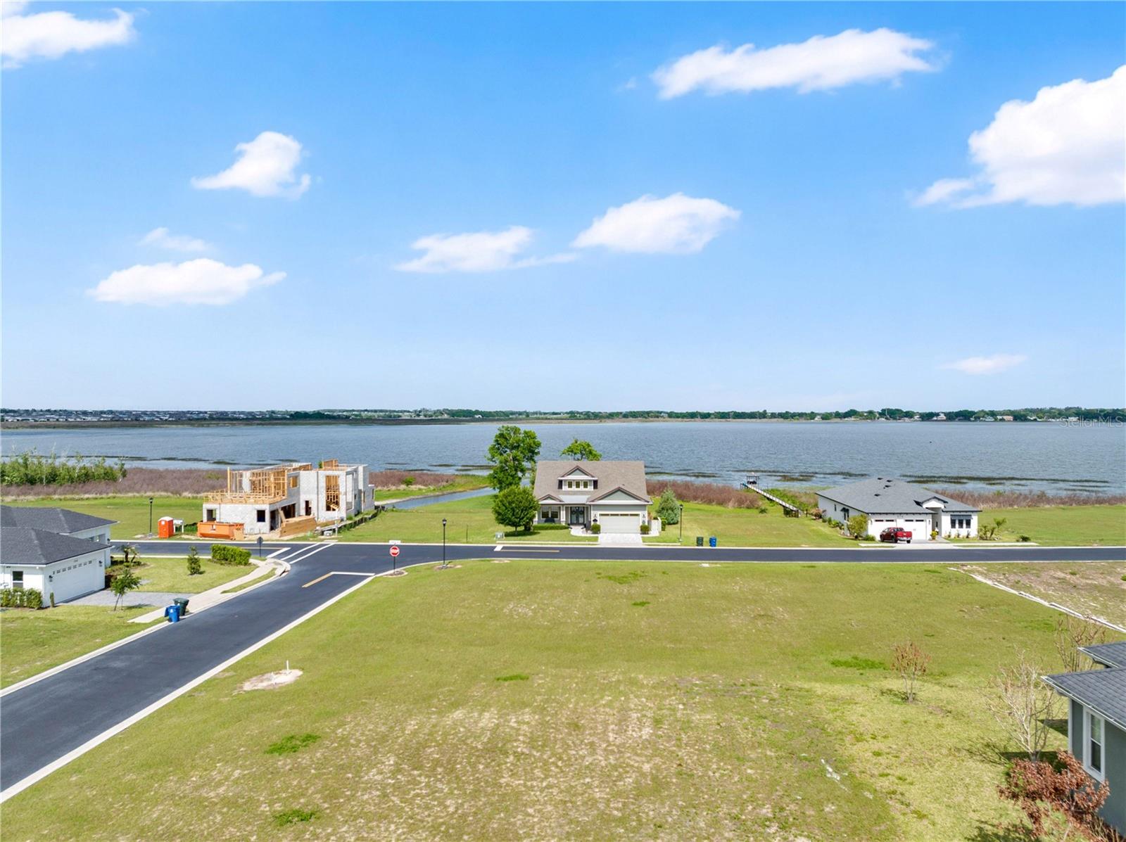 Positioned on a premium corner homesite within the desirable Water Ridge community, this .28-acre lot offers an exceptional opportunity to build with both space and scenic appeal. With approximately 85 feet of frontage and dimensions of 85’ x 118’, the layout provides added flexibility for design, curb appeal, and side-entry garage potential. Enjoy tranquil lake views that elevate the setting and create the perfect backdrop for your future home. Located within a gated, amenity-rich community, Water Ridge delivers a true lifestyle experience with access to a clubhouse, fitness center, onsite HOA management, men’s and women’s saunas, multiple sports courts for basketball, tennis, and pickleball, two leisure pools, a dedicated lap pool, three private boat docks, and convenient boat trailer storage. With five gated entrances and a well-maintained environment, this is an ideal opportunity to secure a standout homesite in a growing and highly desirable Central Florida location.