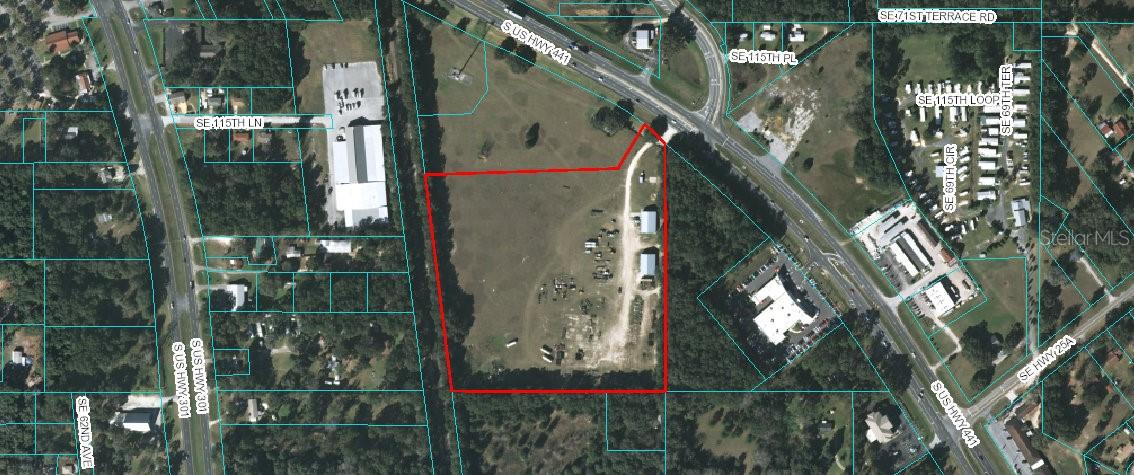 Huge price improvement!!  Seller is motivated and will consider reasonable offers!!15 Ac zoned B-5 allows for self-storage/boat and RV storage. Two concrete block warehouse buildings on site, Buildings are 3600 and 3750 sqft each. Possible lease of the buildings and property or lease purchase with agreeable terms.  Several other uses under B5 zoning matrix (see attachments) No site plan work submitted, up to 325k sq ft allowed with 50 FARs. This site is between The Villages and Ocala. Lots of new development in every direction from here and The Villages growth.  Largest Camping World in the US located just south of property. I-75 just minutes away.