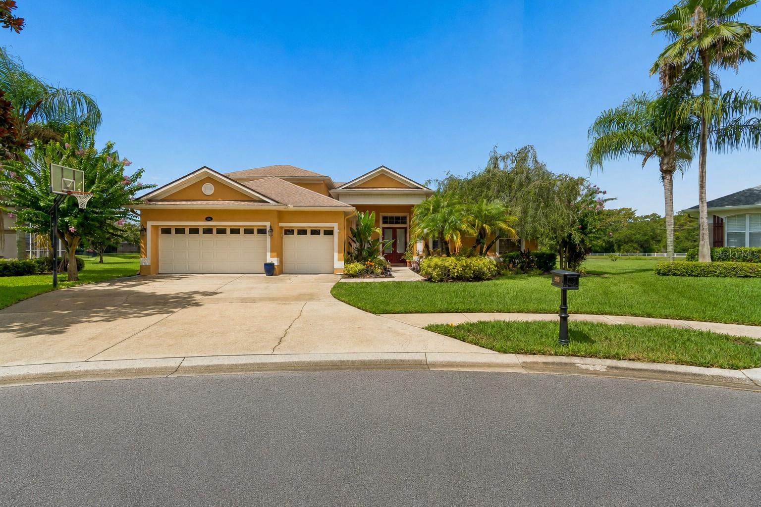 Welcome to 5303 Clouds Peak Drive—a rare opportunity to own an exceptional lakefront residence tucked away on one of the community's most coveted premium cul-de-sac lots. Located within a private gated community and zoned for highly acclaimed Steinbrenner High School, this beautifully maintained home offers the perfect combination of timeless elegance, thoughtful updates, and breathtaking water views that become part of everyday life.

From the moment you arrive, the widened driveway, oversized three-car garage with an additional two feet of depth, lush landscaping, and inviting travertine front porch create an unforgettable first impression. Inside, an expansive, thoughtfully designed floor plan offers generous living spaces that effortlessly balance everyday comfort with elegant entertaining. A dedicated office provides the ideal work-from-home space, while the upstairs bonus room with its own full bathroom offers incredible flexibility as a guest suite, media room, game room, or private bedroom.

Attention to detail is evident throughout, with extensive crown molding, plantation shutters, custom built-in cabinetry surrounding the fireplace, abundant natural light, and quality finishes that create a warm, refined atmosphere. The heart of the home is the spacious kitchen, featuring granite countertops, a large center island, double ovens, an oversized sink with an upgraded faucet, abundant cabinetry, and seamless flow into the main living areas—all while overlooking the sparkling pool and tranquil lake beyond.

The outdoor living space is truly where this home distinguishes itself. The screened lanai showcases an expansive travertine patio surrounding the saltwater pool (solar heated), updated pool lighting, beautifully maintained landscaping, garden beds, and a fully equipped outdoor kitchen featuring a built-in Dynasty propane grill and refrigerator. Whether hosting family gatherings, celebrating special occasions, or simply enjoying a quiet evening outdoors, this backyard was designed to be enjoyed year-round.

The primary suite offers its own private escape, perfectly positioned to capture the same incredible lake and pool views that define the home's outdoor living experience. Waking up to peaceful water views each morning is a luxury few homes can offer.

Beyond its beauty, this home provides tremendous peace of mind with extensive improvements already completed, including a 2021 roof, 2022 HVAC system, renovated bathrooms, new screen enclosure, updated pool pump, solar pool heater, travertine finishes, and numerous additional enhancements throughout—allowing the next owner to simply move in and enjoy.

Premium lake view homes within gated communities are always in demand, but finding one that also offers a cul-de-sac location, exceptional outdoor living, an incredibly functional floor plan, and coveted Steinbrenner High School zoning is exceptionally rare. 5303 Clouds Peak Drive is more than a beautiful home—it's an opportunity to own one of the finest settings in the neighborhood and enjoy the Florida lifestyle exactly as it was meant to be lived.