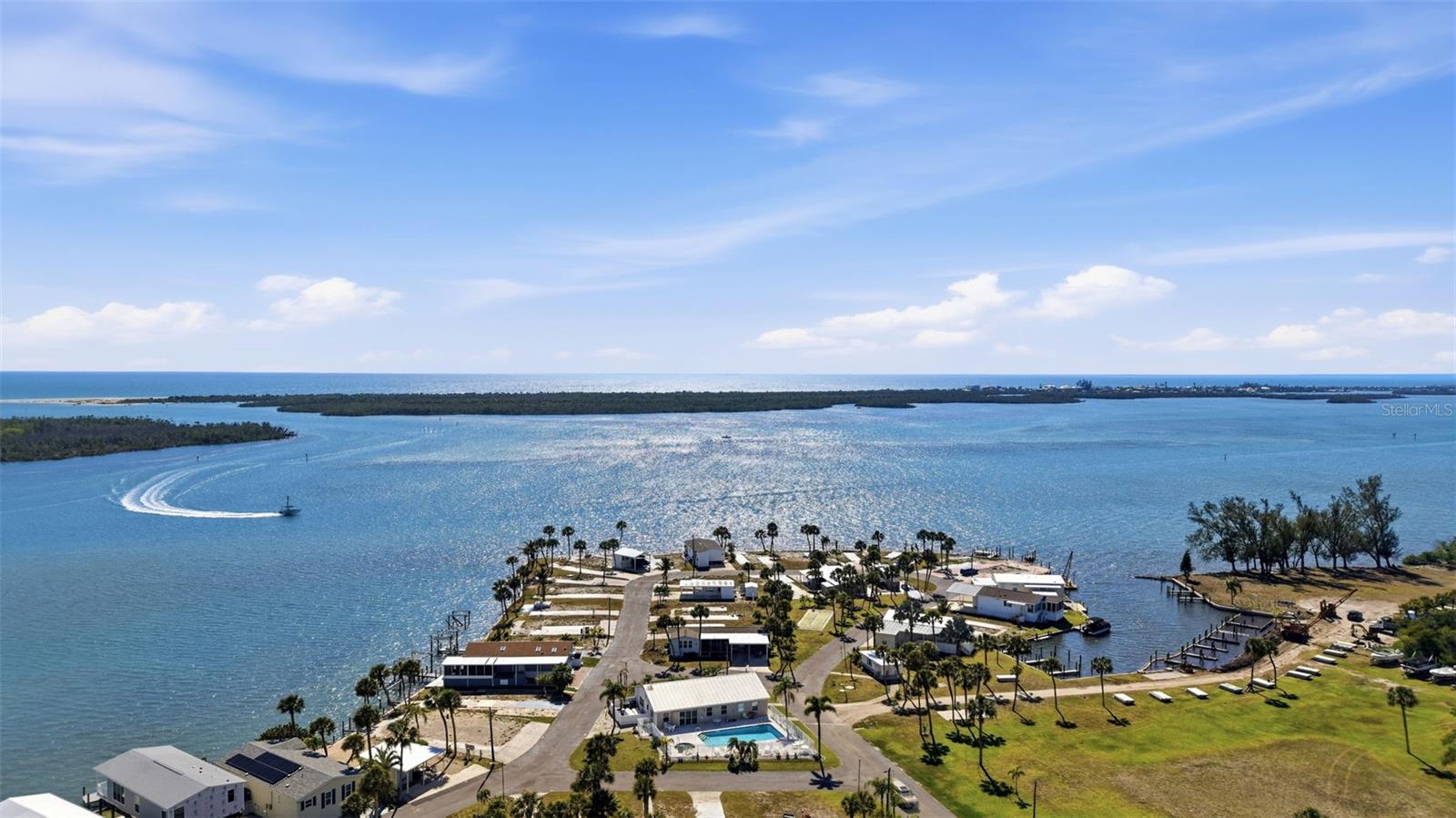 Build your coastal waterfront dream home on this rare, affordable lot in a charming, tight-knit gated community. Design your home on stilts to capture stunning, unobstructed views of the Intracoastal Waterway and enjoy breathtaking sunsets right from your front porch.

This amenity-rich community offers a pool, shuffleboard, on-site manager, dry boat parking, marina, and boat slips (when available)—perfect for embracing the Florida boating lifestyle.

Walk next door to The Lighthouse Grill & Tiki Bar for waterfront dining, or explore everything Englewood has —pristine Gulf beaches, boating, fishing, kayaking, golf courses, boutique shopping, farmers markets, and local festivals.

Live where every day feels like a vacation.