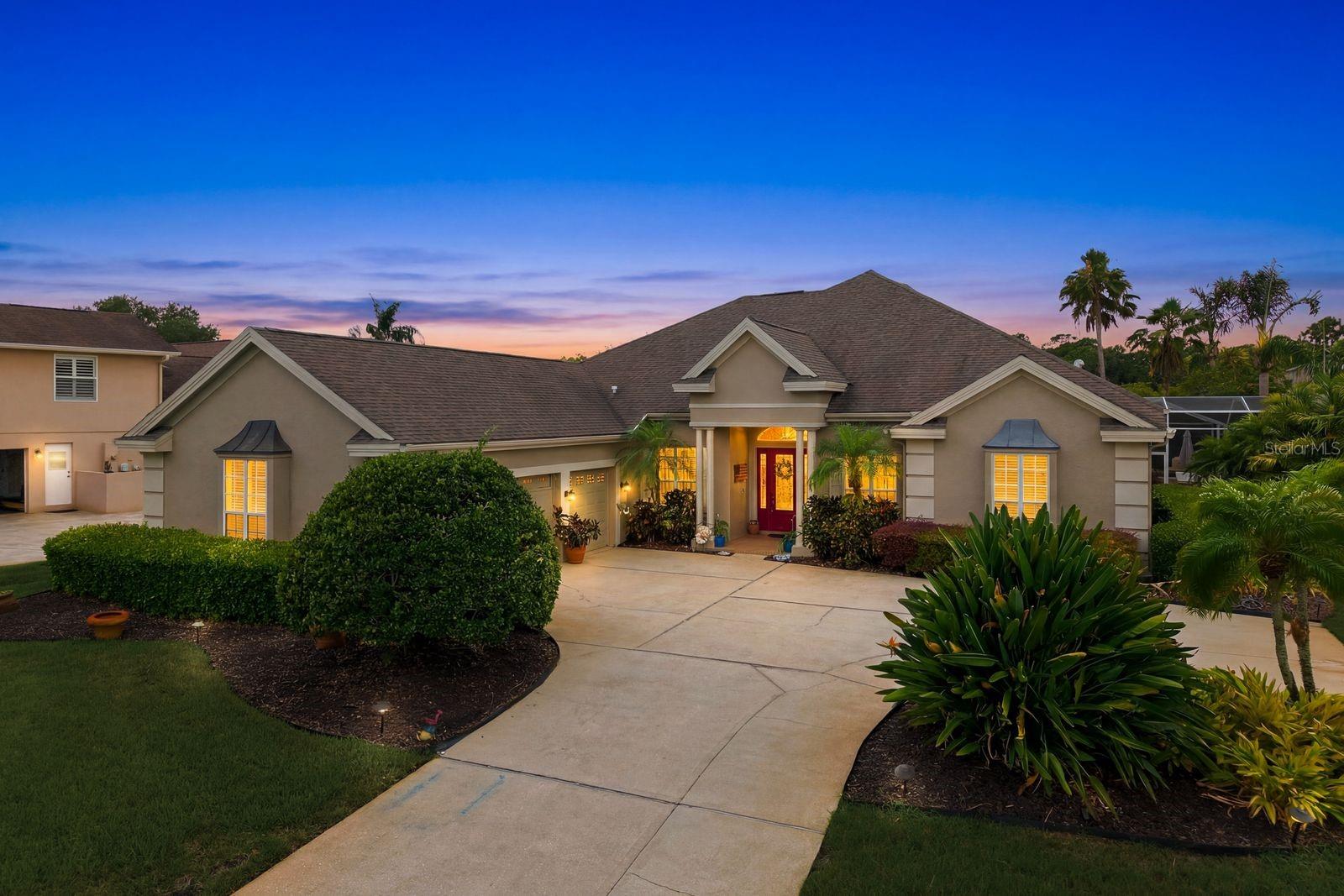 Welcome to an extraordinary opportunity in the Myrtle Point enclave of Lansbrook, where homes rarely become available. This stunning 4-bedroom, 4.5-bathroom executive residence combines thoughtful updates and resort-style outdoor living in one of Palm Harbor’s most sought-after communities. This well-maintained home offers exceptional peace of mind with numerous recent updates, including a 2023 AC system (2 units), 2017 roof, 2021 water heater, 2024 water softener, exterior paint completed in 2024, the well was re-dug in 2022, sprinkler system rewired in 2022, and paid-off 2018 solar panels for the pool. From the moment you enter through the foyer, you'll love the high ceilings, crown molding, abundant natural light, and a flowing floor plan designed for both everyday living and entertaining. Formal living and dining spaces create a lasting first impression, with the dining room featuring a beautiful tray ceiling. A dedicated office showcases real wood flooring, providing the perfect work-from-home space. At the heart of the home is the beautifully updated kitchen, featuring granite countertops, soft-close cabinetry, a natural gas cooktop, double ovens installed in 2023, updated stainless steel appliances, a breakfast bar, and ample storage. The kitchen seamlessly opens to the spacious family room, where custom built-ins and a cozy gas fireplace create a warm and inviting gathering space. The thoughtfully designed split-bedroom layout places all bedrooms on the main level. The luxurious primary suite serves as a private retreat with direct access to the pool through sliding glass doors, dual walk-in closets, and an expansive spa-inspired bathroom featuring separate vanities, a soaking tub, private water closet, and a large tiled walk-in shower. Two secondary bedrooms share a Jack-and-Jill bathroom with dual sinks, while an additional guest suite offers privacy and comfort. A convenient pool half bathroom provides easy outdoor access. Upstairs, a spacious bonus room/loft area with a full bathroom offer endless possibilities for a media room, game room, guest retreat, fitness area, or additional living space. Step outside to your own private Florida paradise. The screened lanai showcases a sparkling pool and spa. Entertain effortlessly with the outdoor kitchen featuring a grill and bar area, gather around the outdoor fireplace on cool evenings, or enjoy al fresco dining beneath the covered lanai while overlooking the beautifully landscaped backyard. Residents of Lansbrook can enjoy access to a gated waterfront park and outstanding community amenities, including parks, a pavilion, scenic walking trails, and a private boat ramp providing access to Lake Tarpon. Conveniently located near championship golf courses, top-rated schools, shopping, dining, and everyday conveniences, this remarkable residence delivers the luxury lifestyle you've been waiting for. Don't miss your opportunity to make it yours. Schedule your showing today!